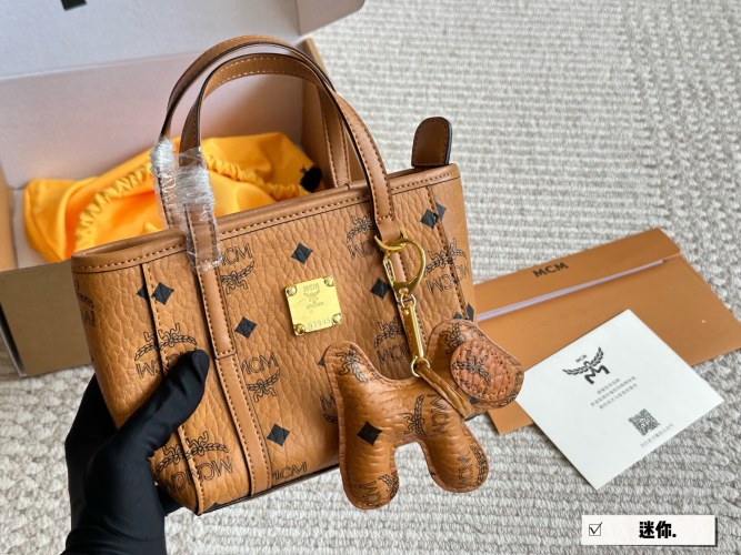MCM Cognac Color Leather Mini Basket Bag with Dog Charm, 17*14 cm 1 MCM Cognac Color Leather Mini Basket Bag with Dog Charm, 17*14 cm
