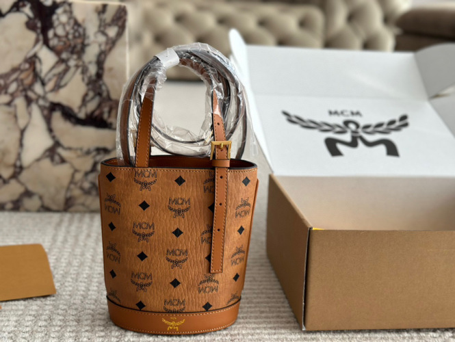 MCM Small Bucket Bag in Cognac Visetos with Top Handle and Adjustable Strap 1 MCM Small Bucket Bag in Cognac Visetos with Top Handle and Adjustable Strap