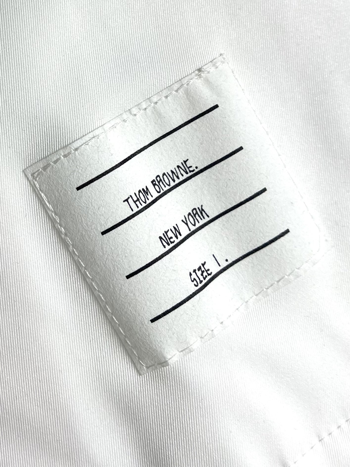 Thom Browne TB新款防裂棒球领飞行夹克 防撕裂斜纹质感层搭设计经典四条纹标签罗纹直领正面饰有