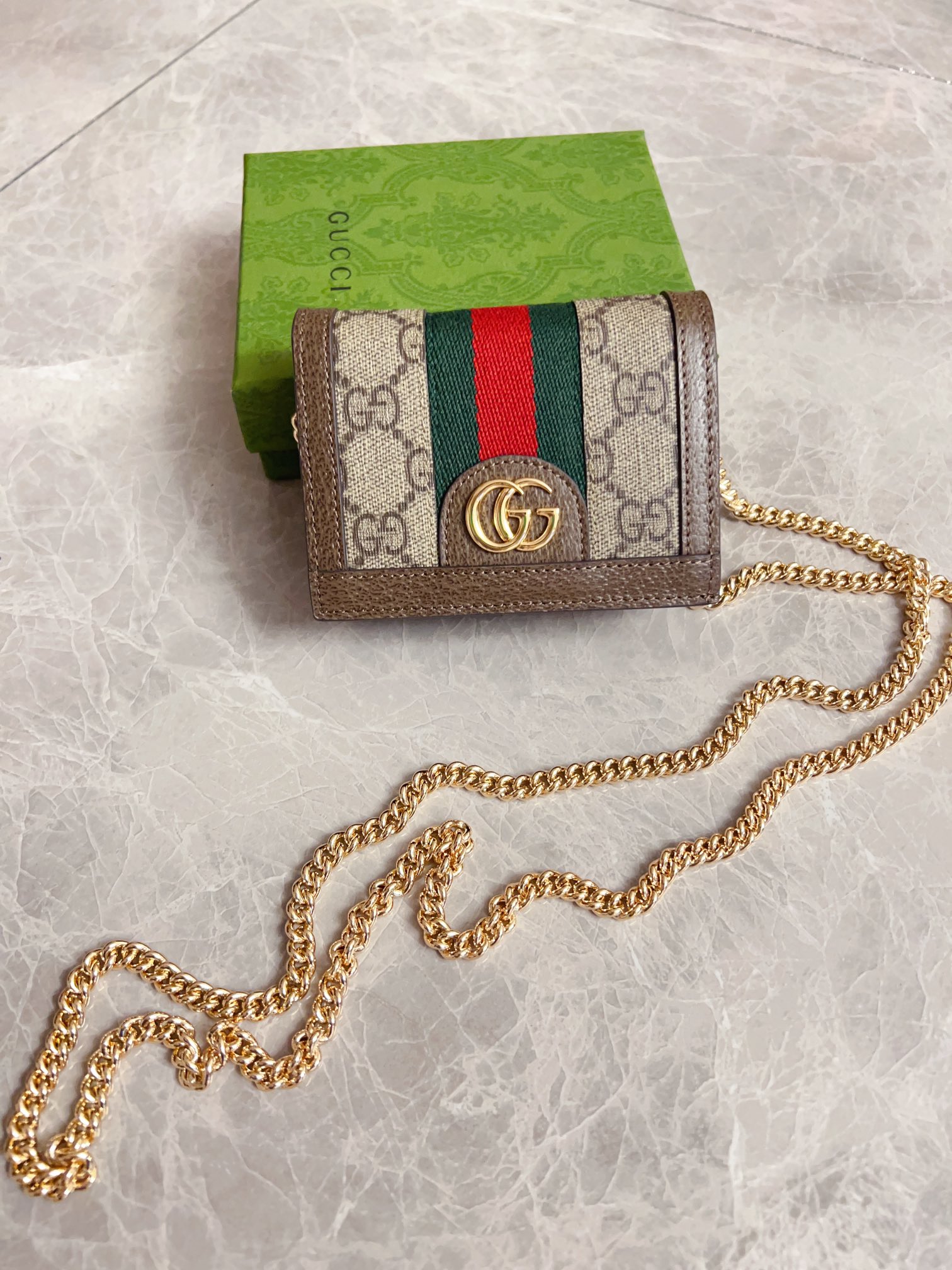 NO:672151,The official website synchronizes new styles!  Ophidia series~Chain short card holder/wallet is made of GG Supreme high-grade PVC fabric with iconic double G hardware marks and classic red and green webbing, exquisitely made!  Style number: 625711, size: W11xH9xD3cm, color coffee, Gucci wallet, gucci, wallets19860909官网同步新款！Ophidia系列～链条短款卡包/钱夹采用GG Supreme高级PVC面料配以标志性双G 五金唛头,经典著作红绿色织带,精制而成！款号:625711,尺寸: W11xH9xD3cm ,颜色咖啡,Gucci钱包,gucci,wallets,欧美剧