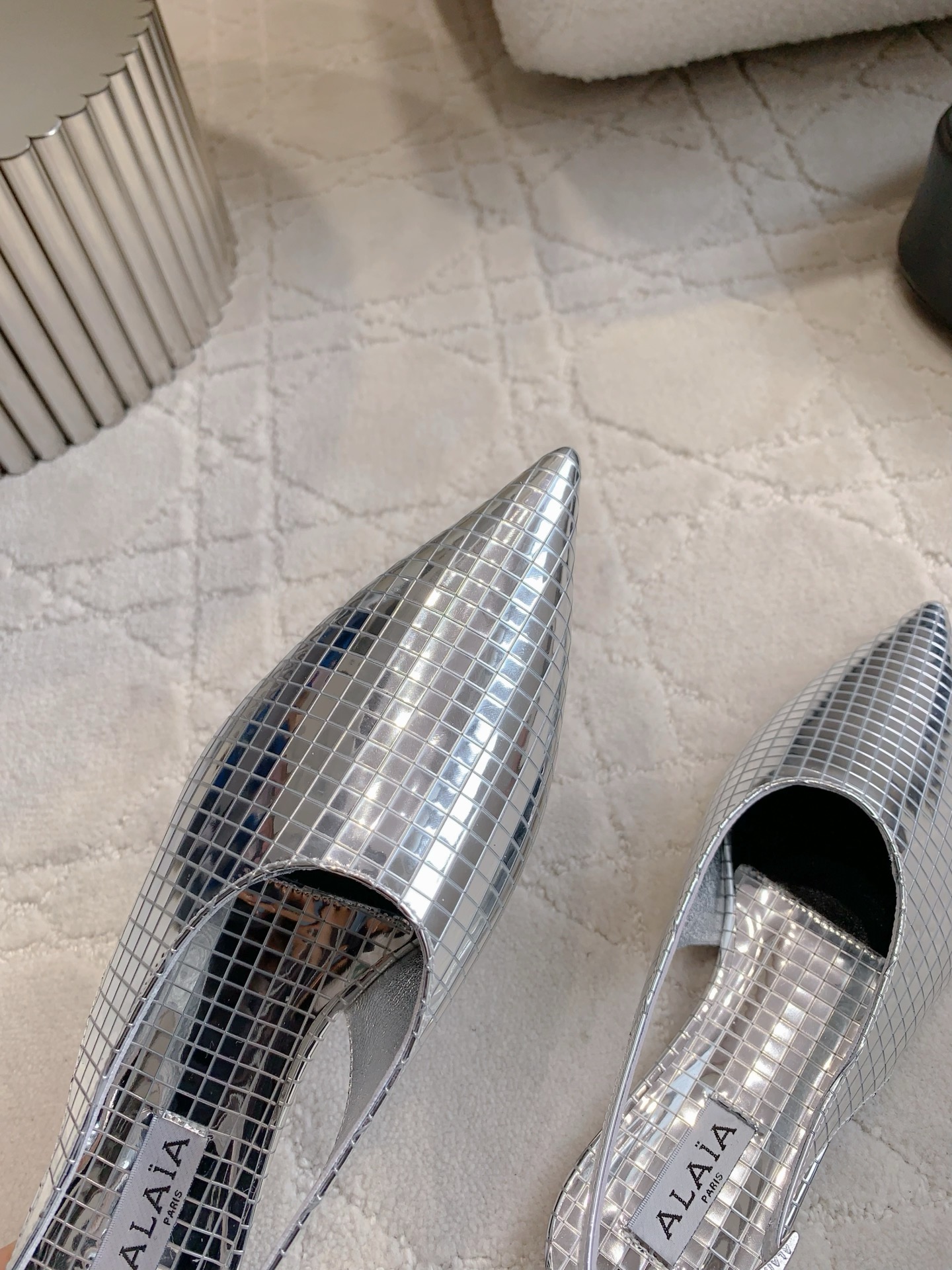 Alaia’s Futuristic Mirror Metal Flat Shoes: Price at 696. - 图片 5