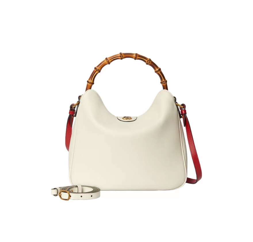 Gucci G746124 Size: 30/23/6.5cm! This medium-sized shoulder bag cleverly combines two of the brand's most recognizable elements - bamboo handles
