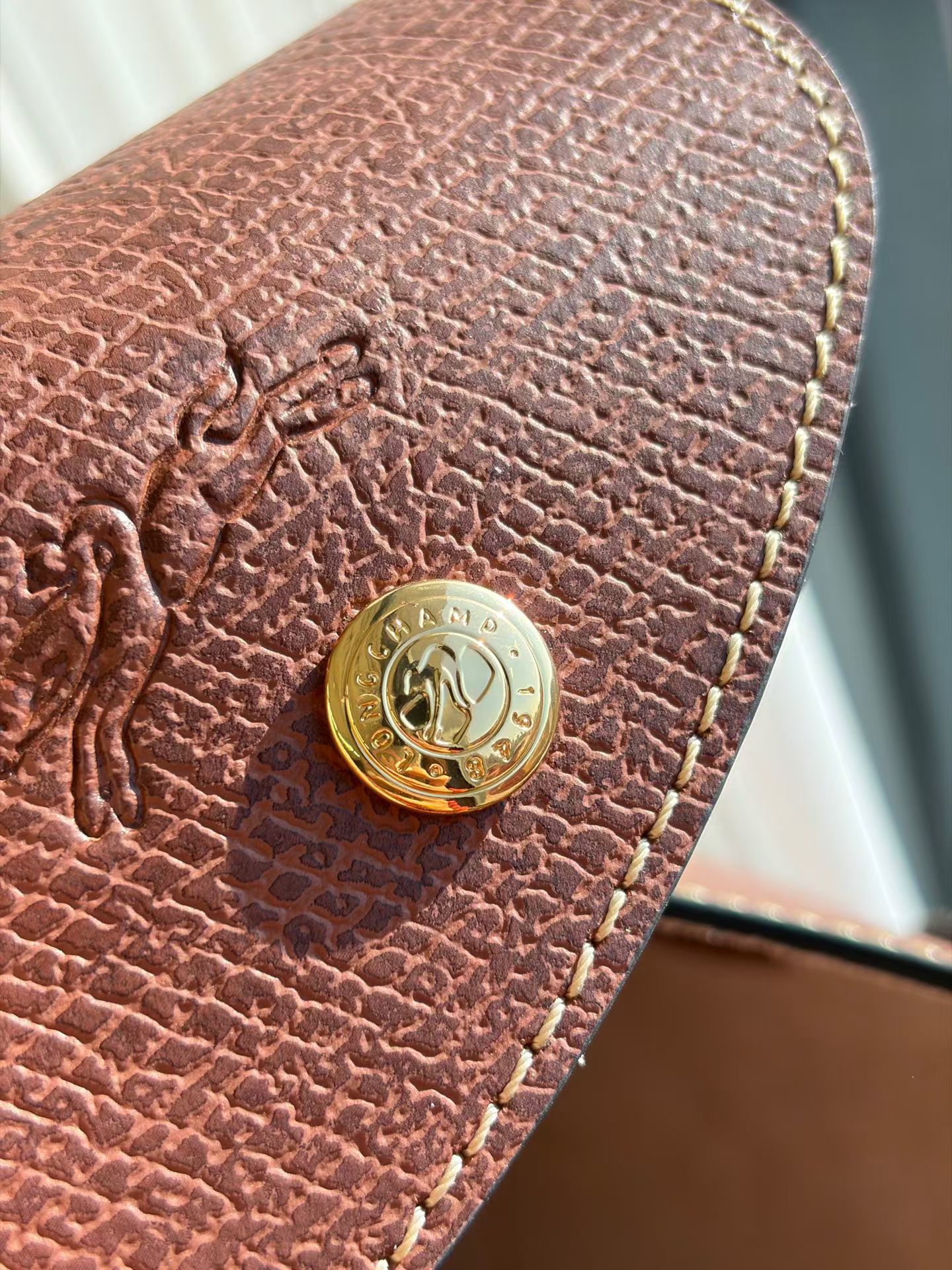 Longchamp The quality of the hardware is as excellent as ever. Not much to say.