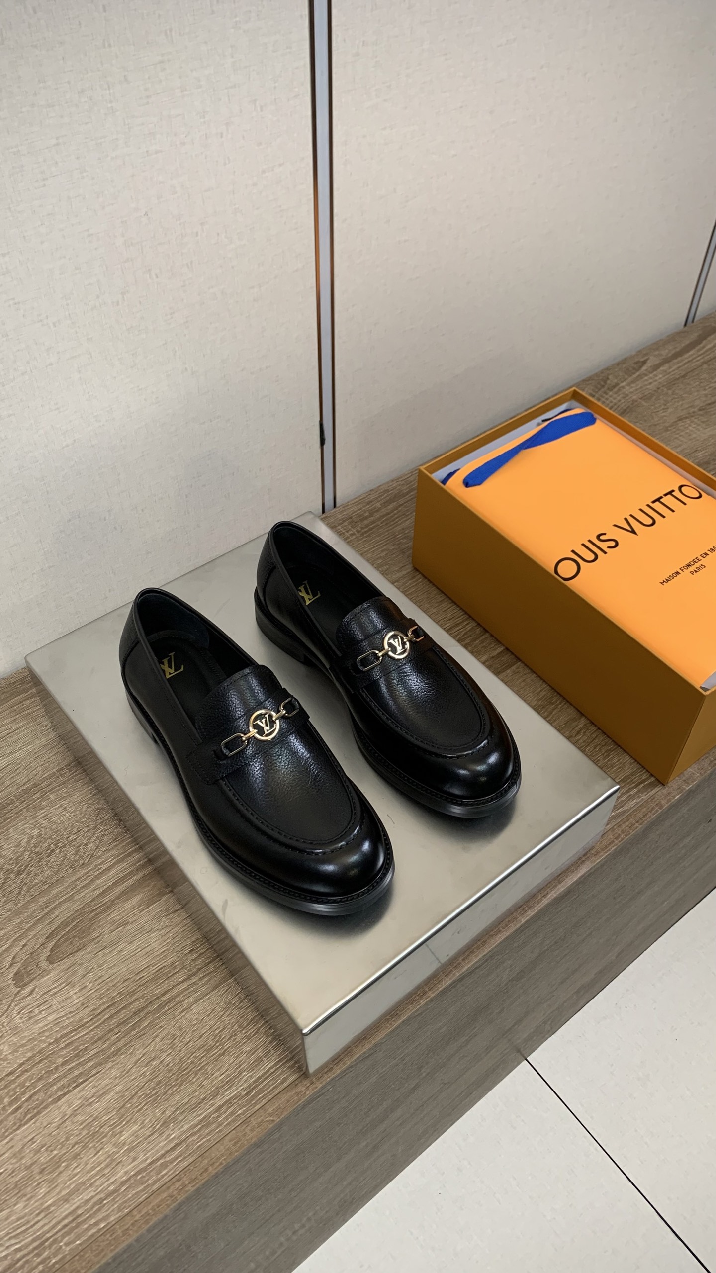 Louis Vuitton Men's Black Leather Loafers with Gold-Tone Hardware