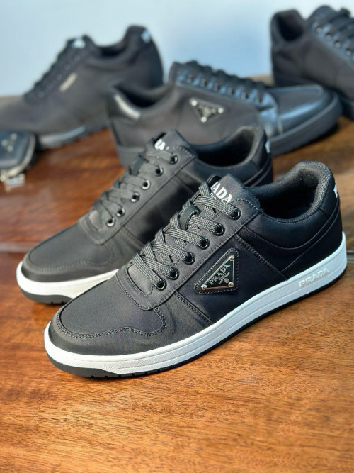 Prada Men's Nappa Leather Low-Top Sneakers with Metal Logo - Black 1 Prada Men's Nappa Leather Low-Top Sneakers with Metal Logo - Black