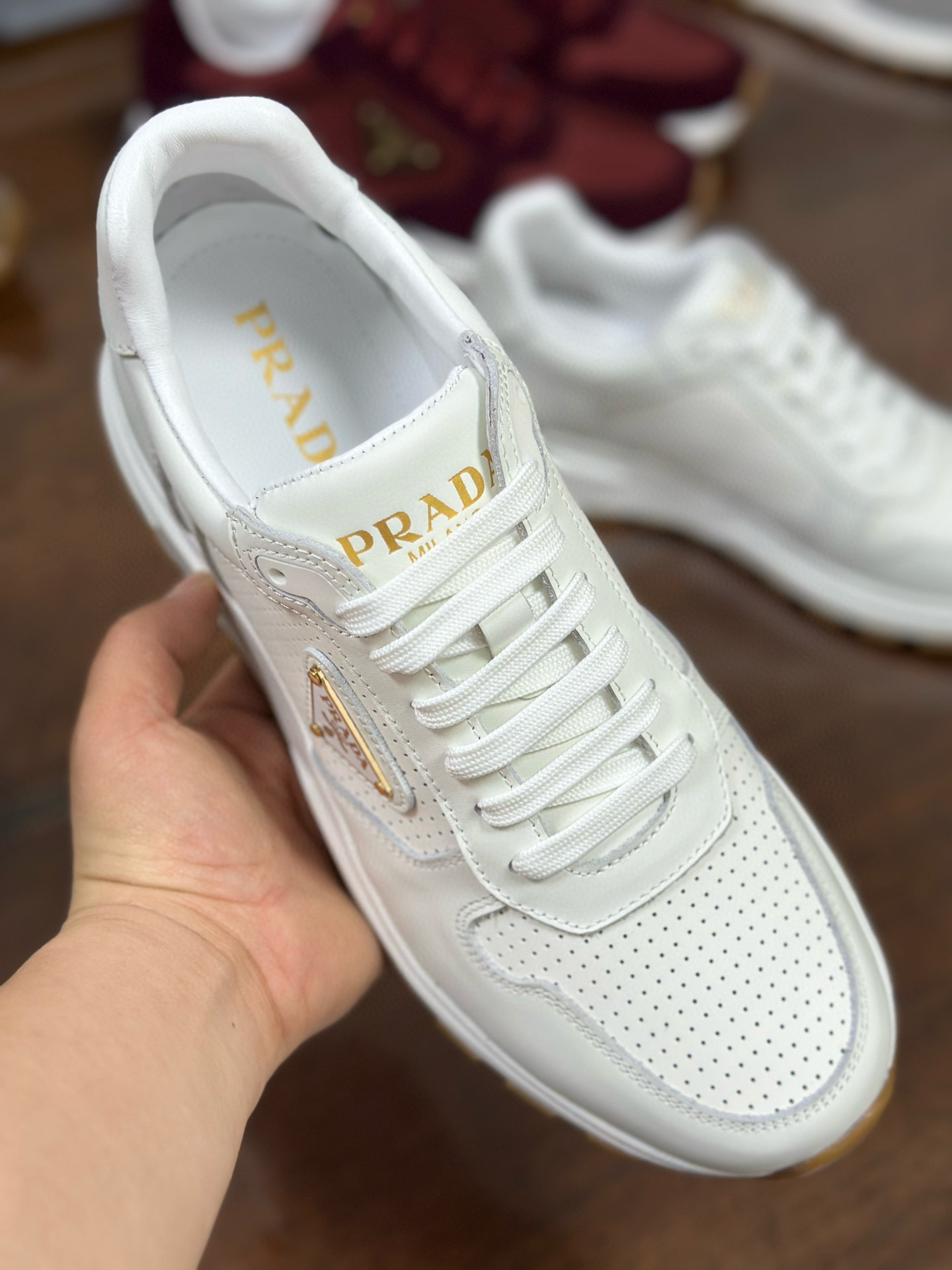 Prada Prax 2.0 White Leather Sneakers with Perforated Design and Iconic Logo 7 i1751161838565 5640 0 5