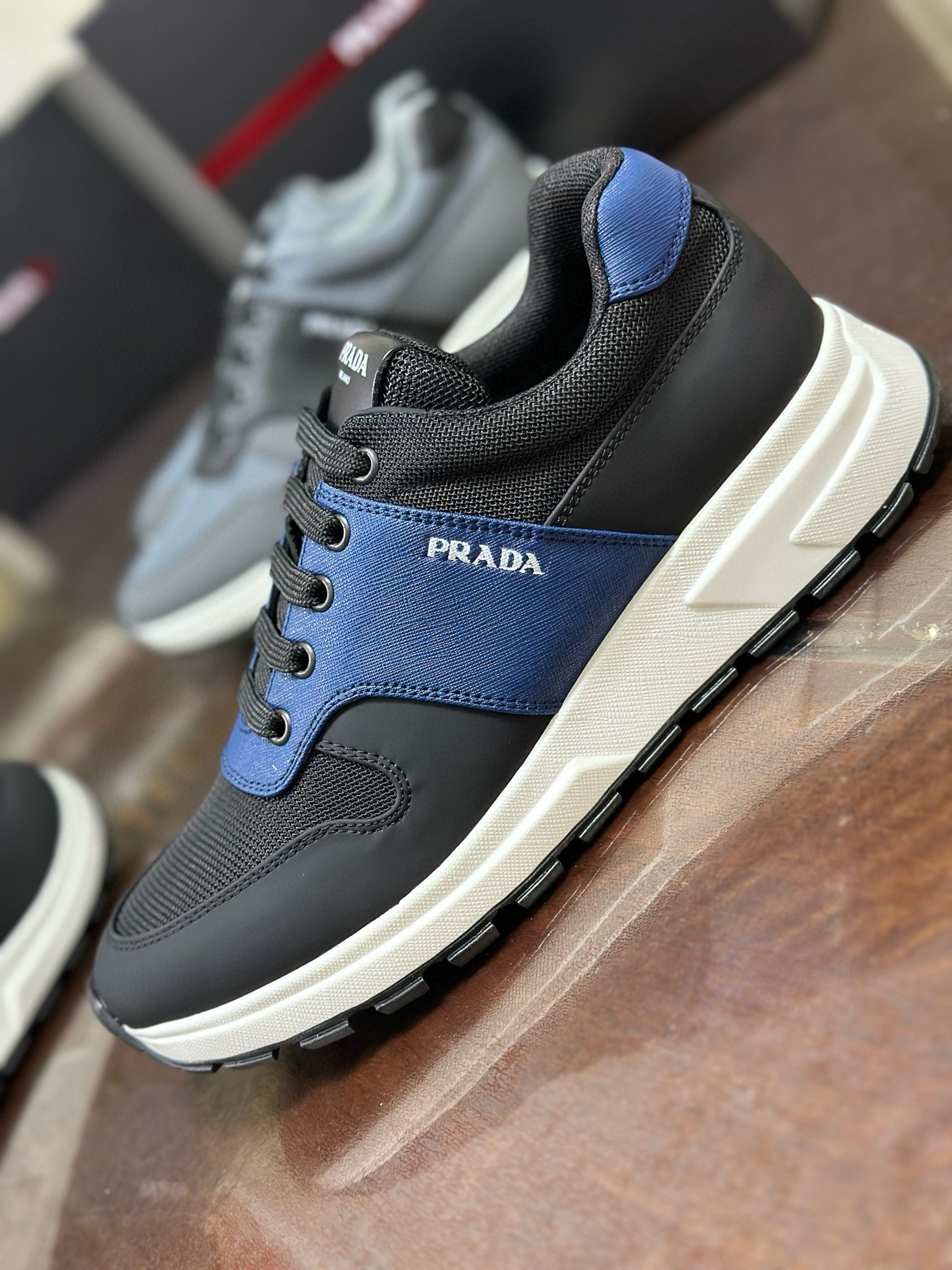 Prada Men's Leather and Mesh Sneakers: Italian Craftsmanship, Stylish Comfort 3 i1752284385341 3147 0 1