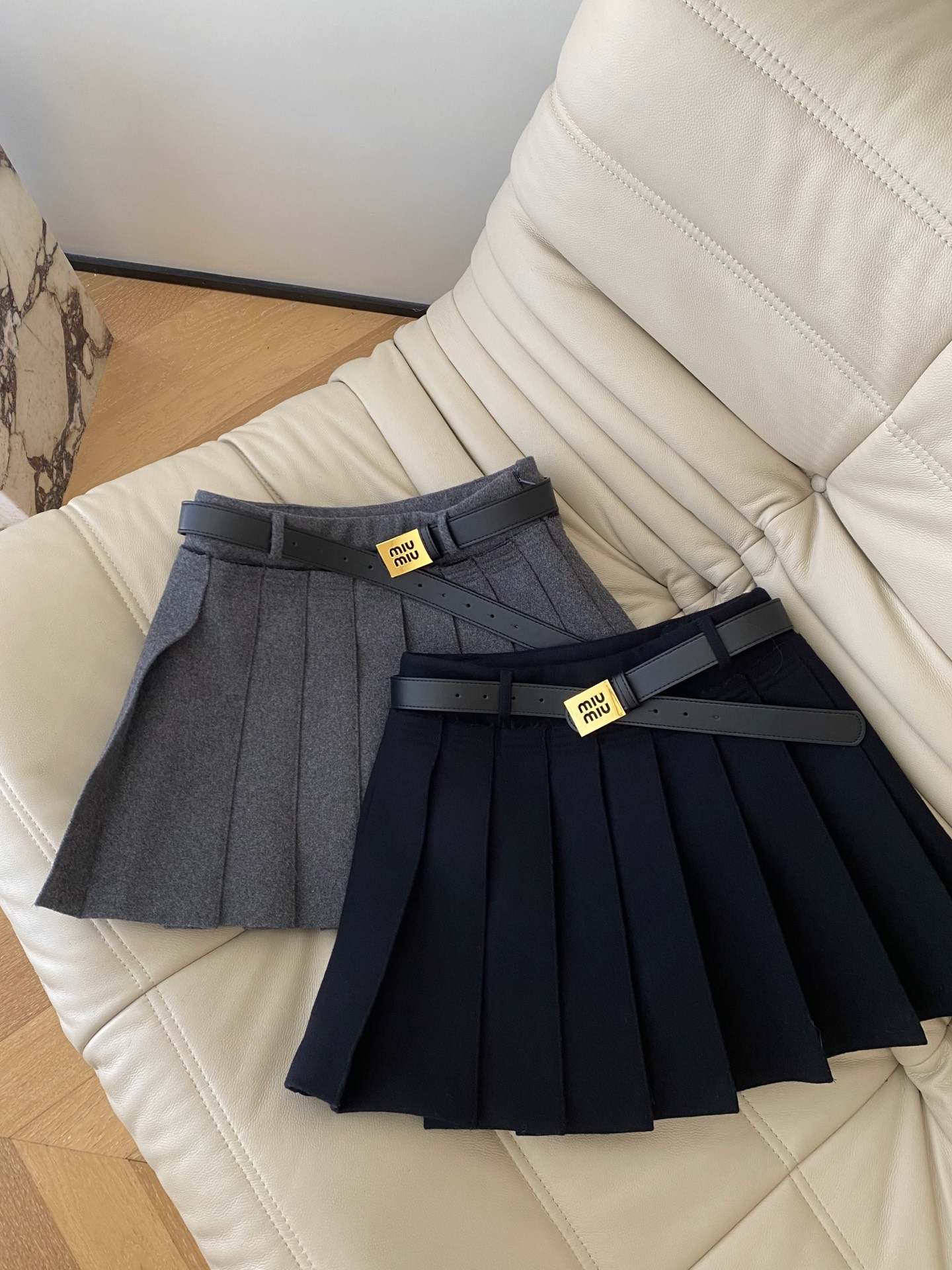 Miu Miu High-Waisted Pleated Mini Skirt with Metal Belt – Fall/Winter Collection