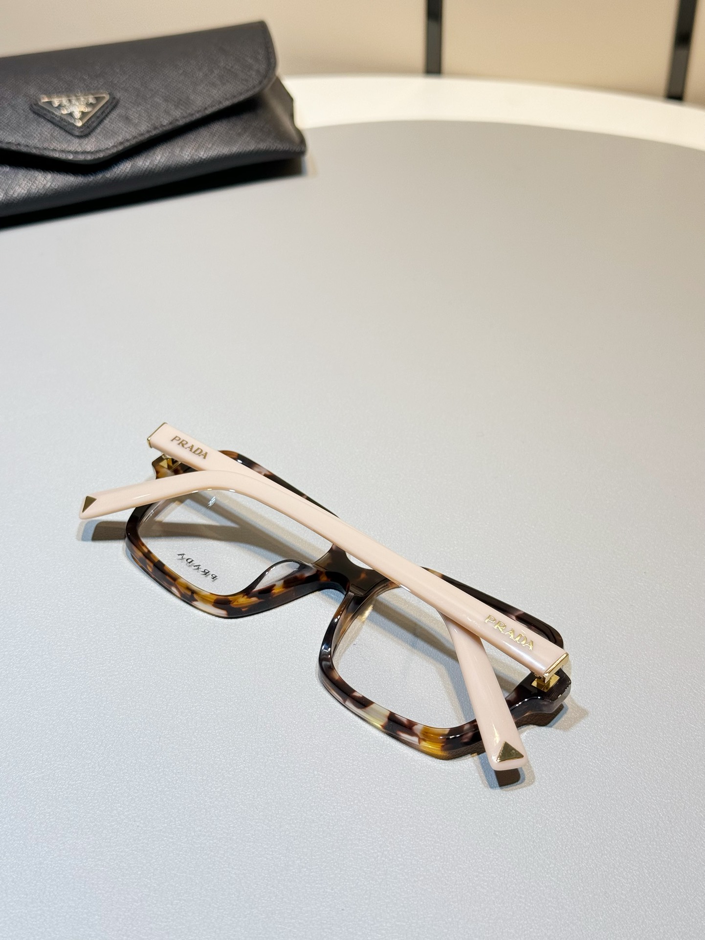 Prada Tortoiseshell pink legs