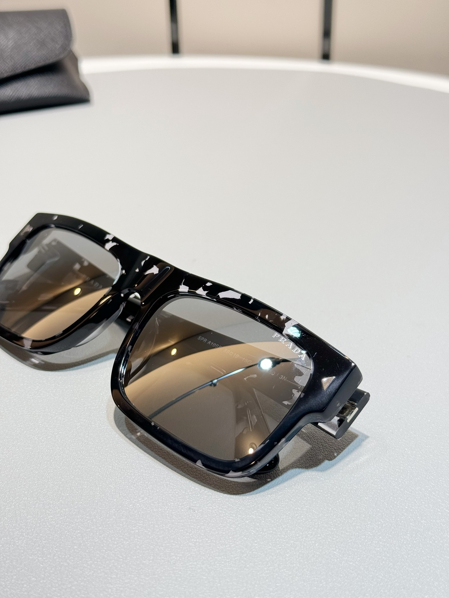 Prada Gray tortoise color (mercury lens)