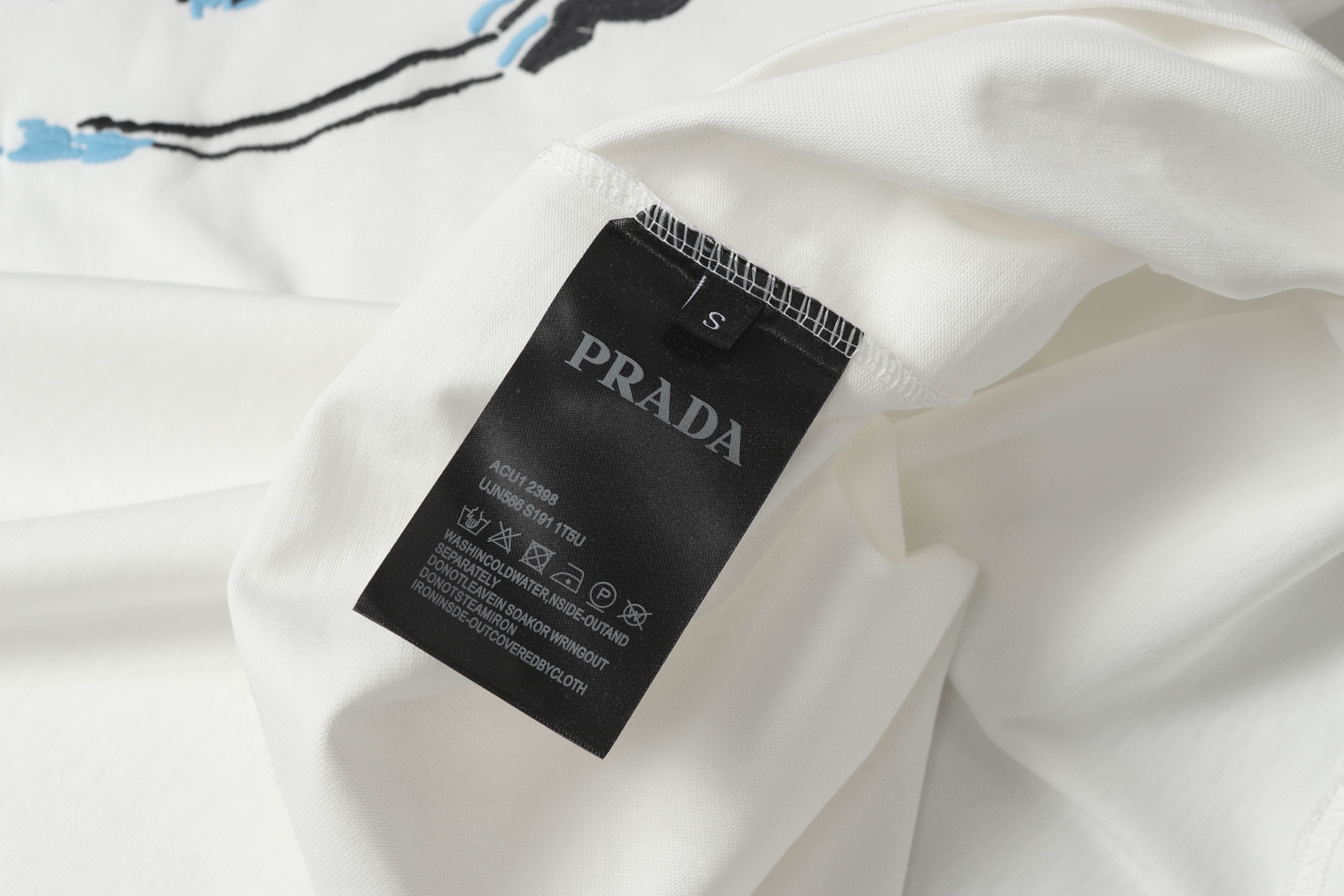 Prada Camiseta de Algodón con Bordado Circular y Logotipo para Hombre y Mujer 8 i1750002849378 8260 0 6