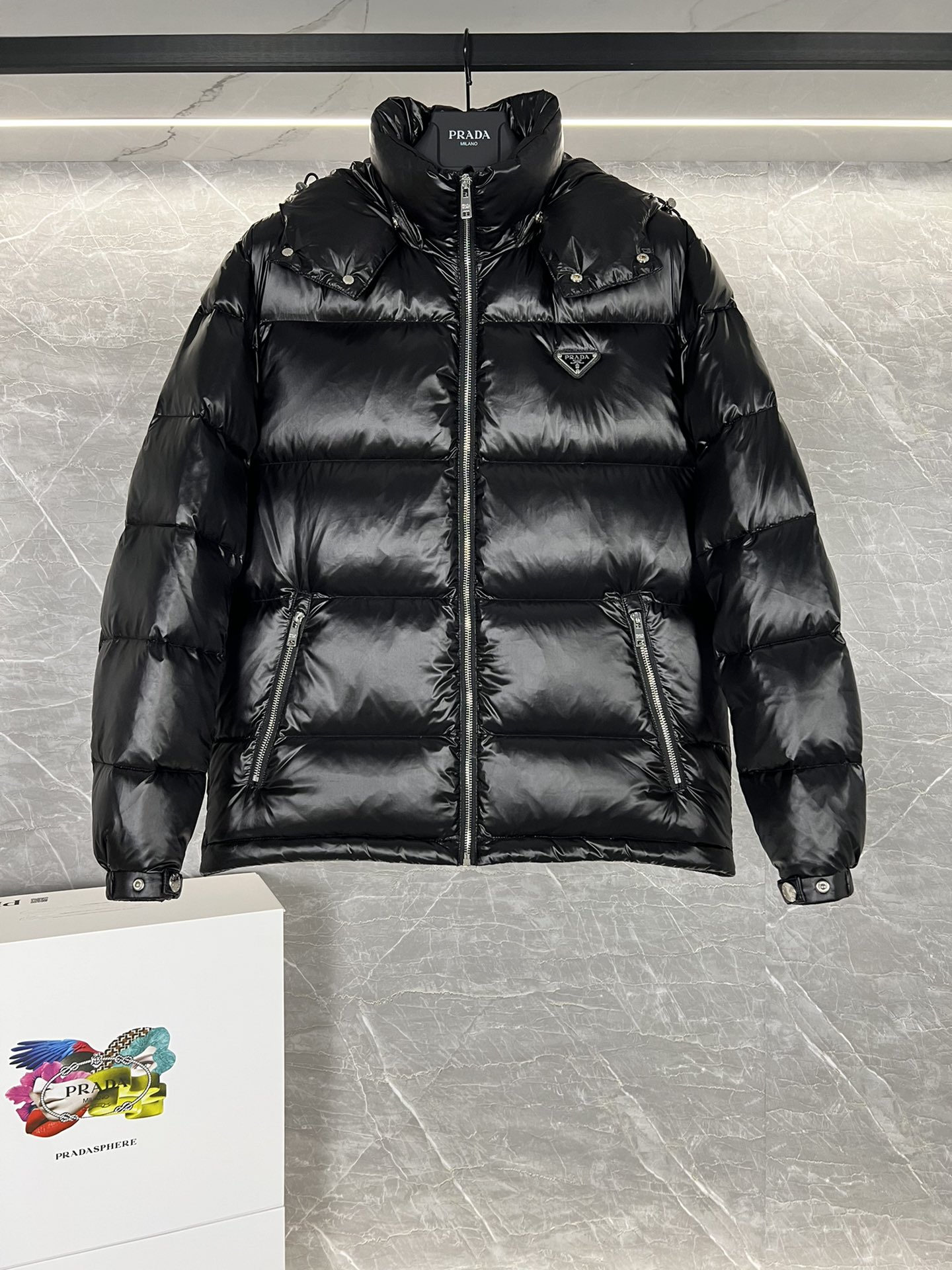 Top Prada Re-Nylon Thick Jacket with 90% down filling. Minimalist design, recycled material. Sizes 48-56, colors black and blue.-Big cat