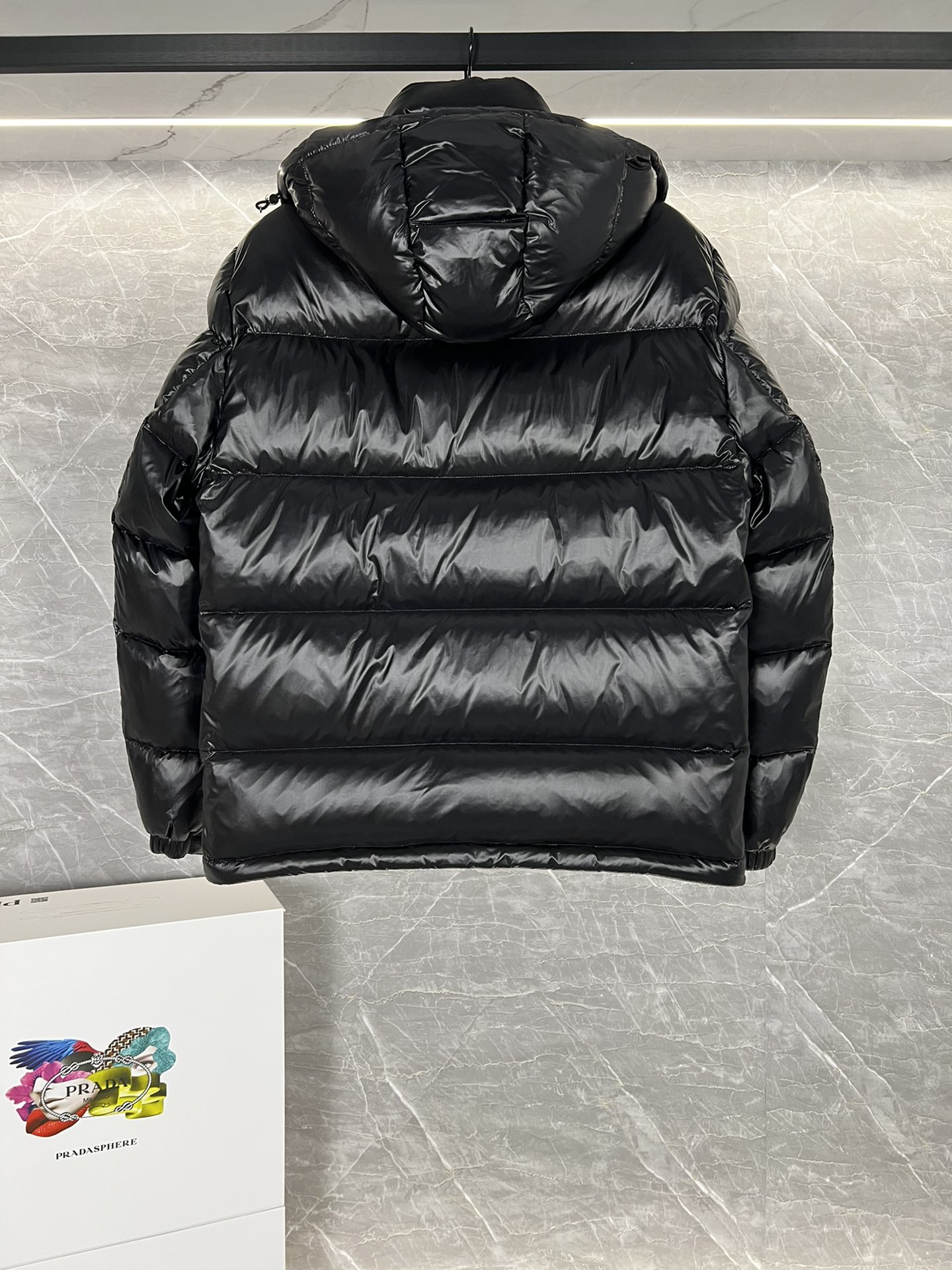 Top Prada Re-Nylon Thick Jacket with 90% down filling. Minimalist design, recycled material. Sizes 48-56, colors black and blue.-Big cat