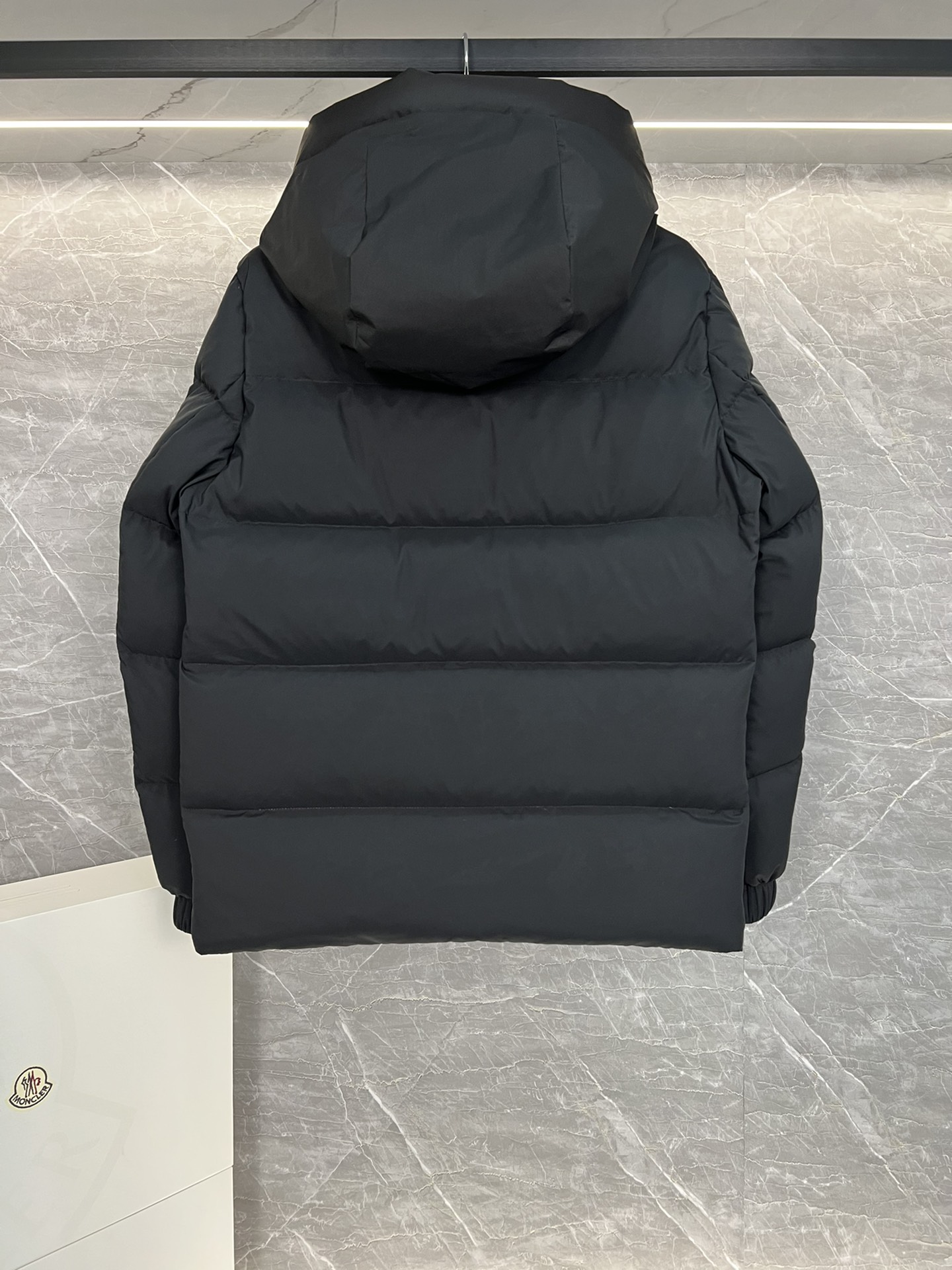 Top Moncler Madeira short down jacket for men and women, designed for adventure and warmth. Functional, stylish, suitable for street or ski wear. Features durable nylon, hood, down filling, snap/zip closure, zippered pockets, elastic hem. Sizes 1-5, two colors.-Big cat