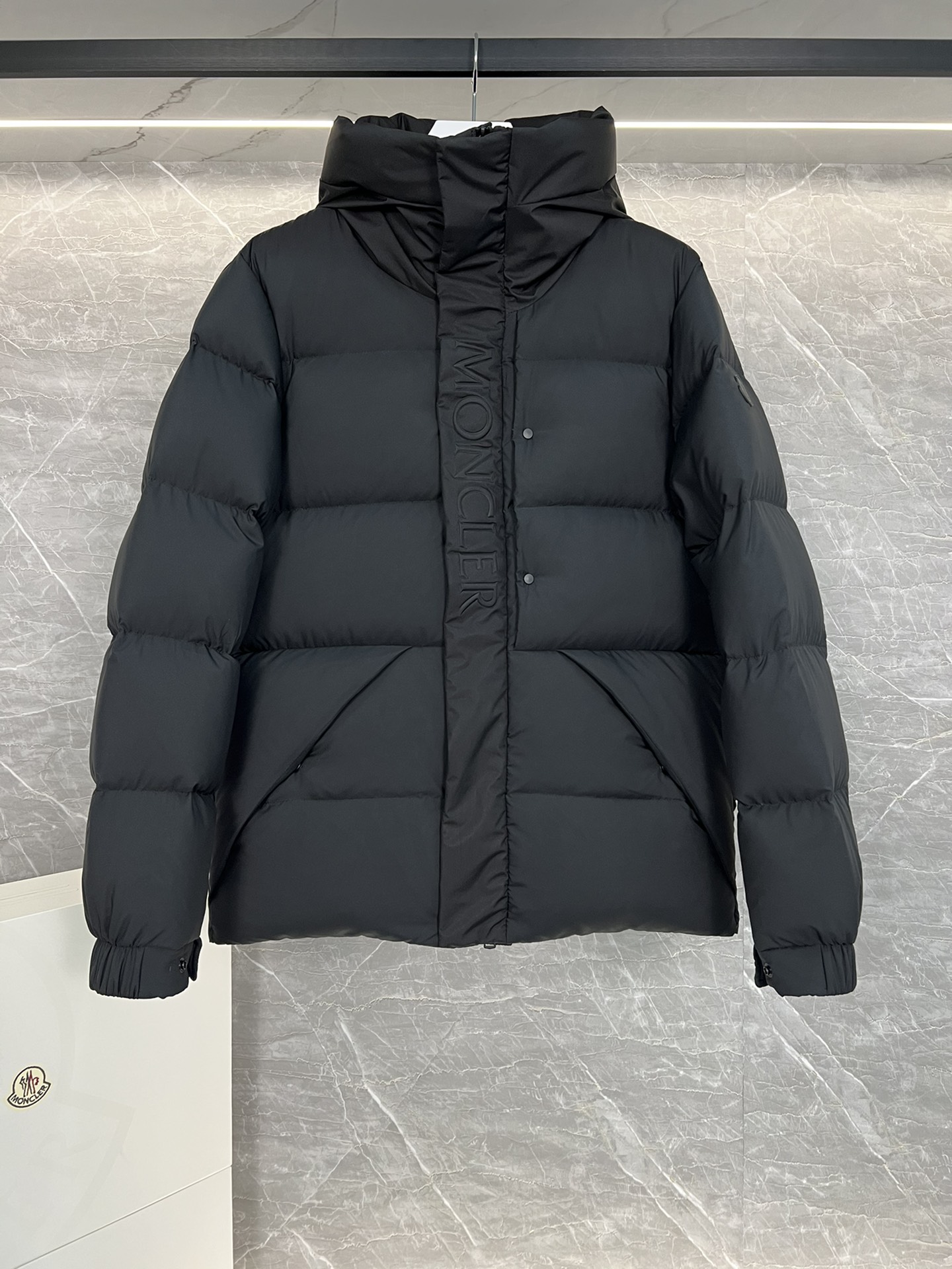 Top Moncler Madeira short down jacket for men and women, designed for adventure and warmth. Functional, stylish, suitable for street or ski wear. Features durable nylon, hood, down filling, snap/zip closure, zippered pockets, elastic hem. Sizes 1-5, two colors.-Big cat