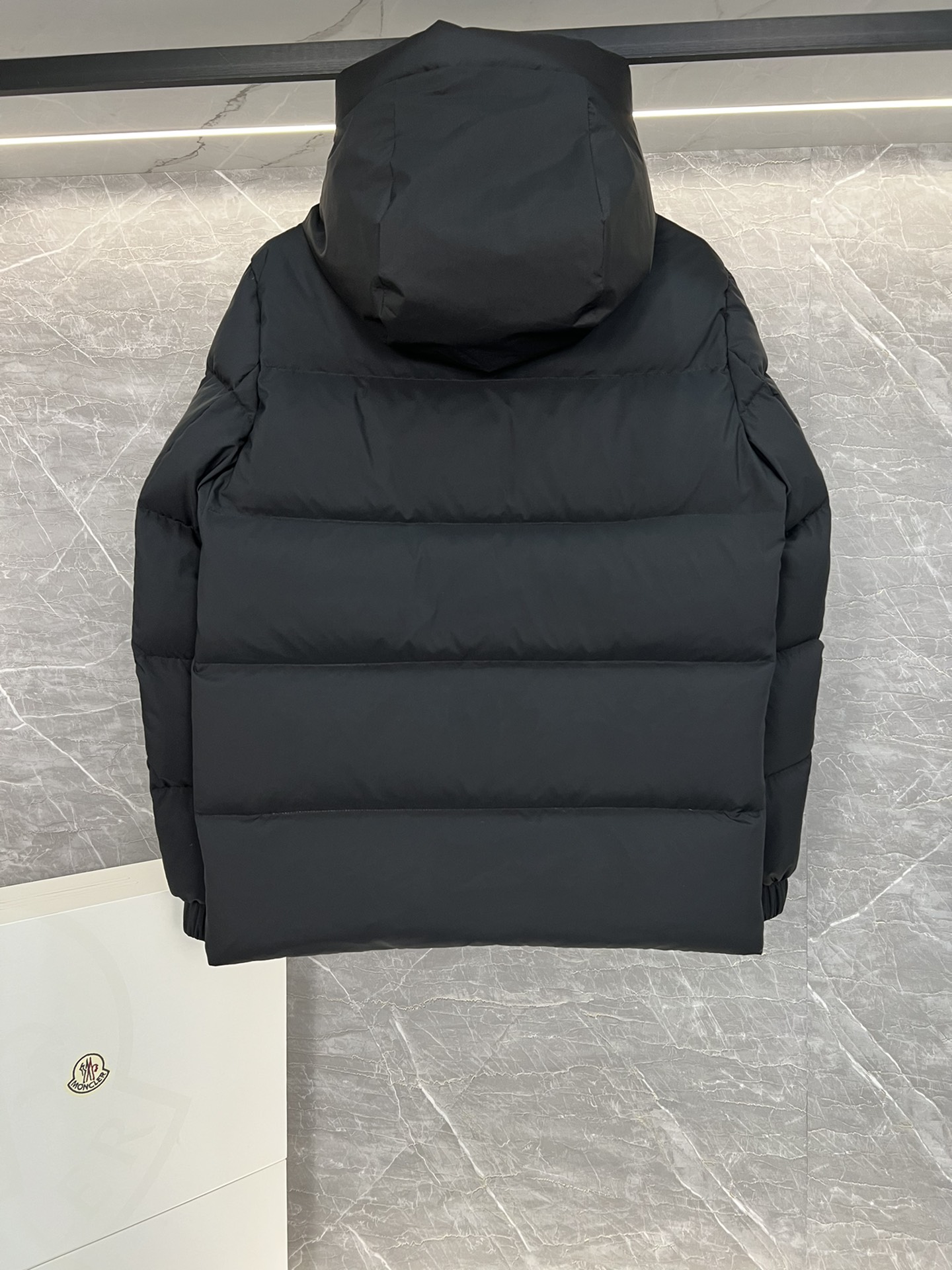Top Moncler Madeira short down jacket for men and women, designed for adventure and warmth. Functional, stylish, suitable for street or ski wear. Features durable nylon, hood, down filling, snap/zip closure, zippered pockets, elastic hem. Sizes 1-5, two colors.-Big cat