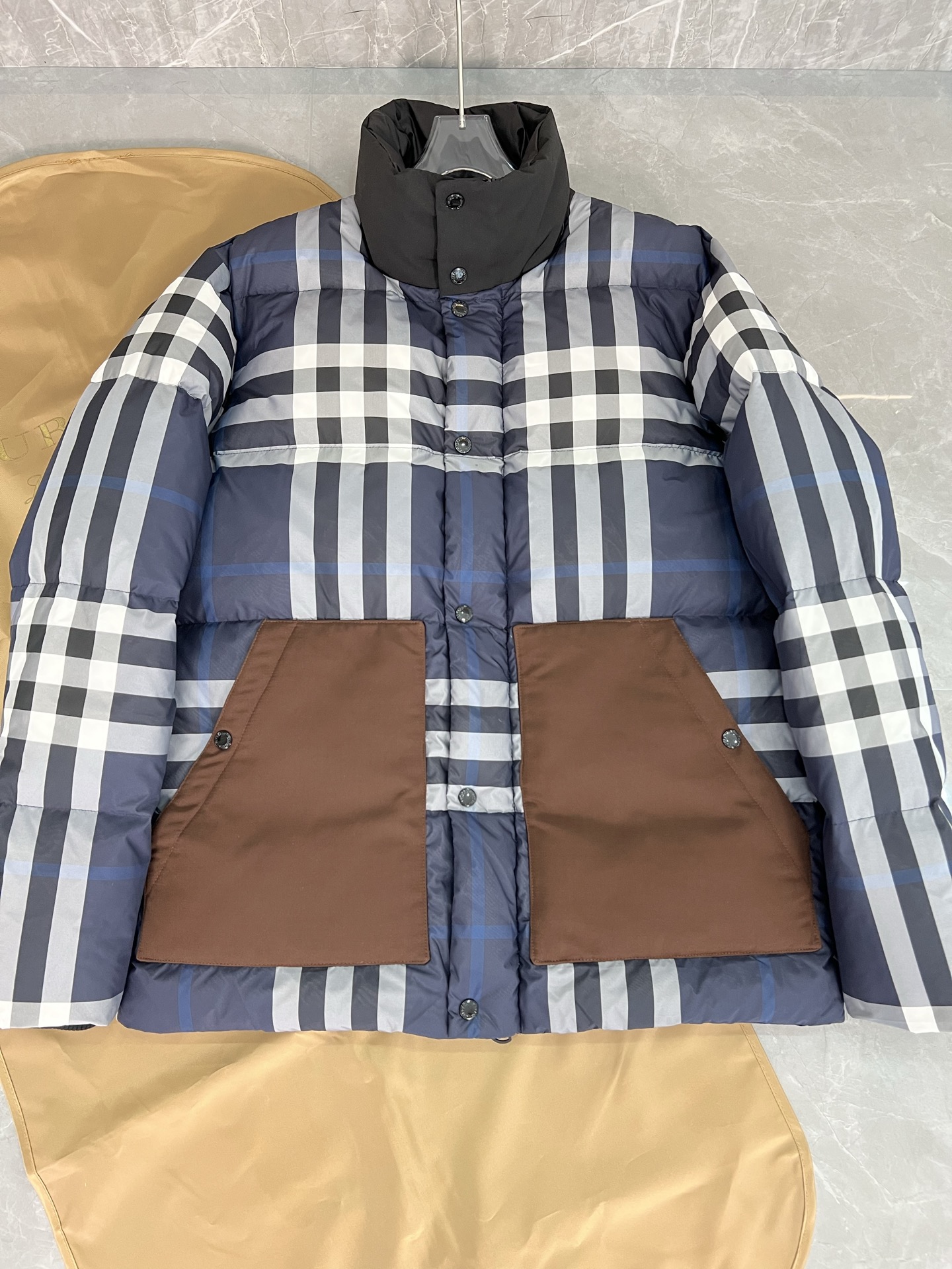 Guangzhou high-end Burberry down jacket for Winter 2025. Premium version with iconic check, high collar, removable hood, and water-resistant fabric. Available in versatile colors and sizes M-XXXL. Limited stock!-Big cat
