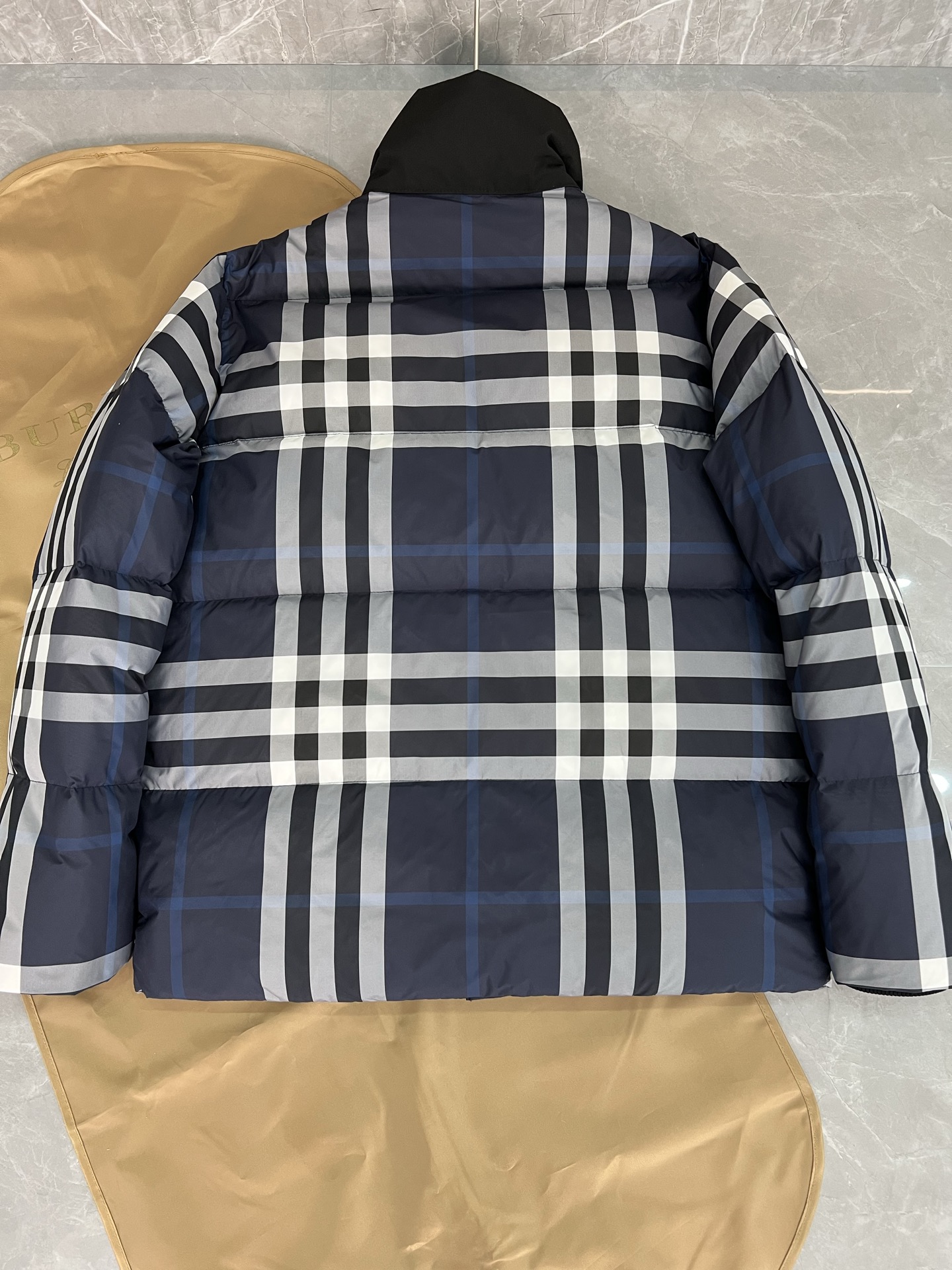 Guangzhou high-end Burberry down jacket for Winter 2025. Premium version with iconic check, high collar, removable hood, and water-resistant fabric. Available in versatile colors and sizes M-XXXL. Limited stock!-Big cat