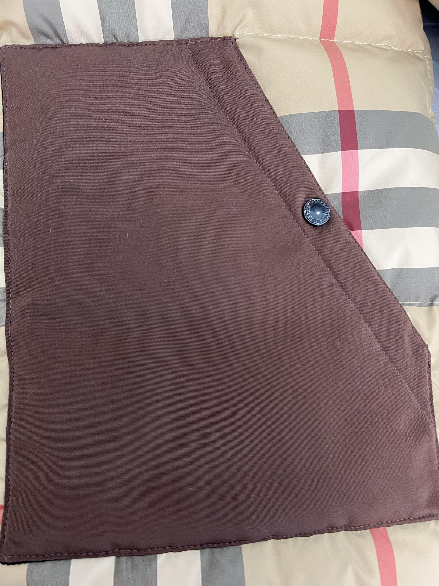 Guangzhou high-end Burberry down jacket for Winter 2025. Premium version with iconic check pattern, warm yet lightweight. Features high collar, removable hood with faux fur. Available in versatile colors, sizes M to XXXL. Limited stock.-Big cat