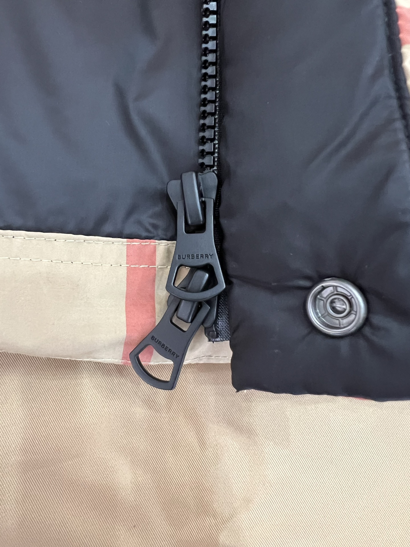 Guangzhou high-end Burberry down jacket for Winter 2025. Premium version with iconic check pattern, warm yet lightweight. Features high collar, removable hood with faux fur. Available in versatile colors, sizes M to XXXL. Limited stock.-Big cat