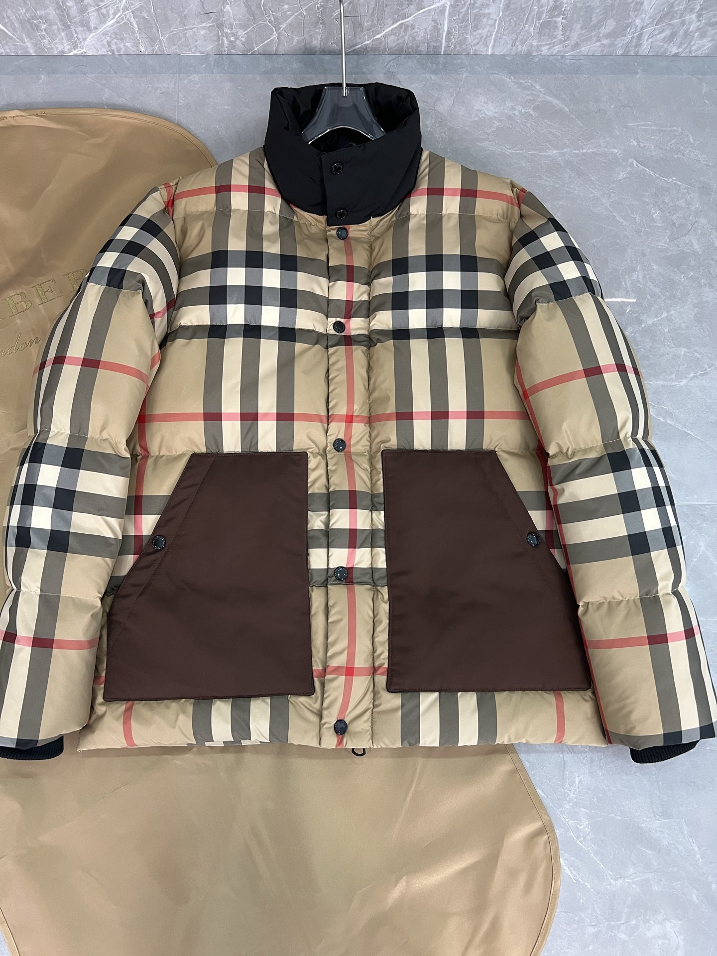 Guangzhou high-end Burberry down jacket for Winter 2025. Premium version with iconic check pattern, warm yet lightweight. Features high collar, removable hood with faux fur. Available in versatile colors, sizes M to XXXL. Limited stock.-Big cat