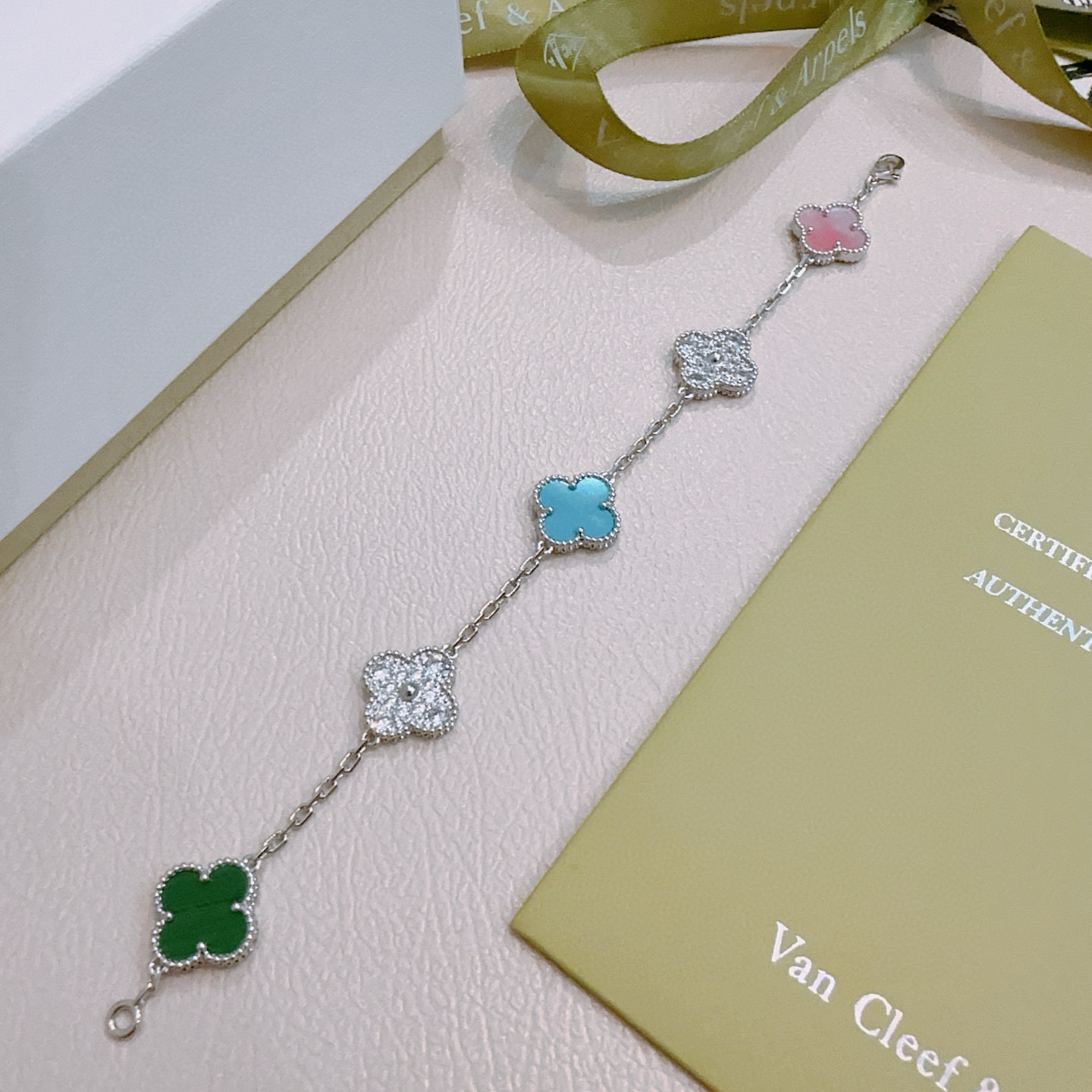 Van Cleef Arpels Alhambra bracelet Silver-toned metal with green malachite pink mother-of-pearl turquoise blue and clear diamond-paved four-leaf clover motifs 18cm
