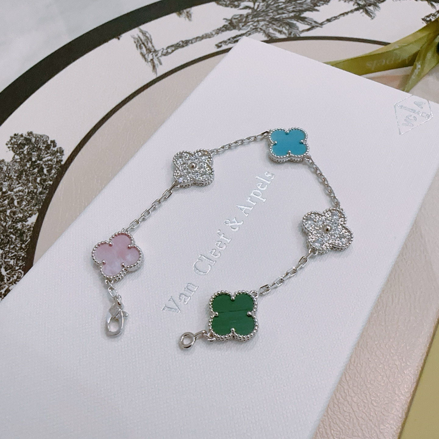 Van Cleef Arpels Alhambra bracelet Silver-toned metal with green malachite pink mother-of-pearl turquoise blue and clear diamond-paved four-leaf clover motifs 18cm
