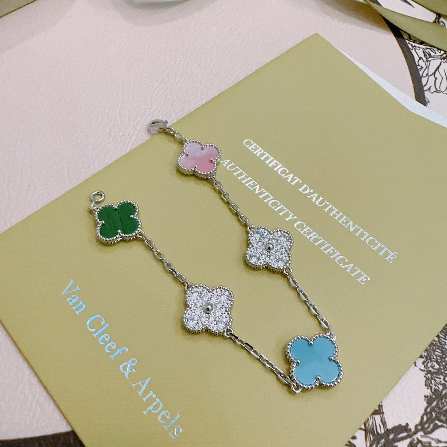 Van Cleef Arpels Alhambra bracelet Silver-toned metal with green malachite pink mother-of-pearl turquoise blue and clear diamond-paved four-leaf clover motifs 18cm