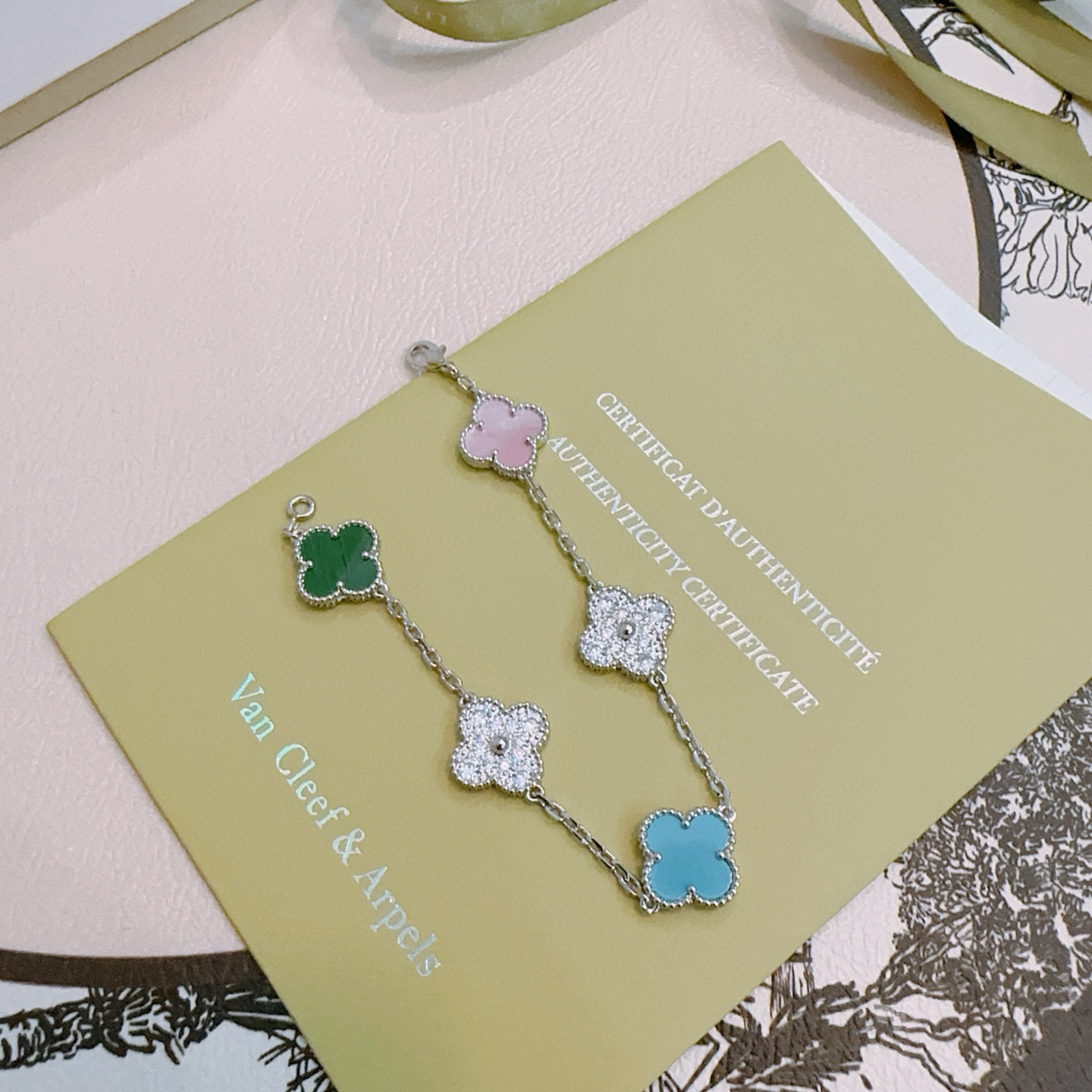 Van Cleef Arpels Alhambra bracelet Silver-toned metal with green malachite pink mother-of-pearl turquoise blue and clear diamond-paved four-leaf clover motifs 18cm