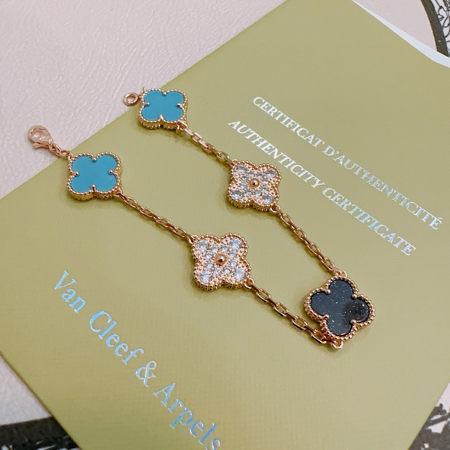 Van Cleef Arpels Alhambra bracelet Rose gold metal with turquoise blue black and clear diamond-accented four-leaf clover motifs 18cm