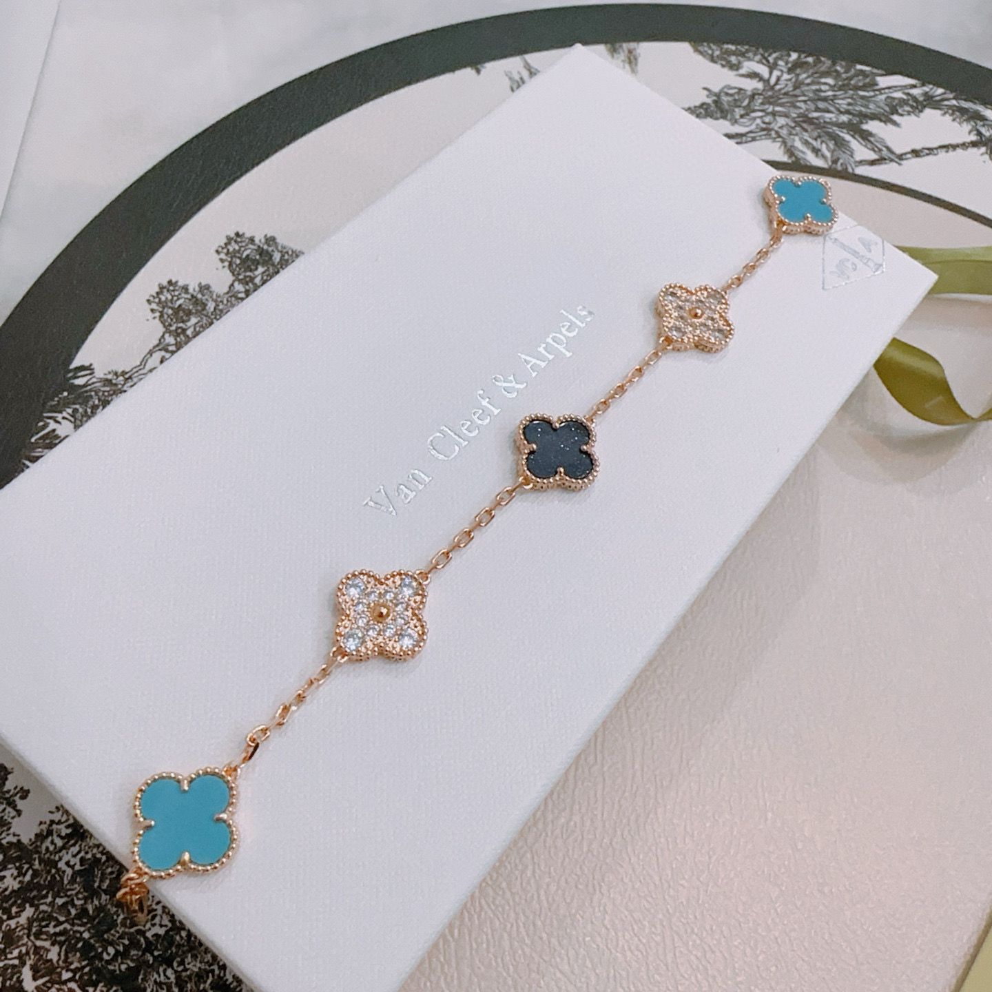 Van Cleef Arpels Alhambra bracelet Rose gold metal with turquoise blue black and clear diamond-accented four-leaf clover motifs 18cm