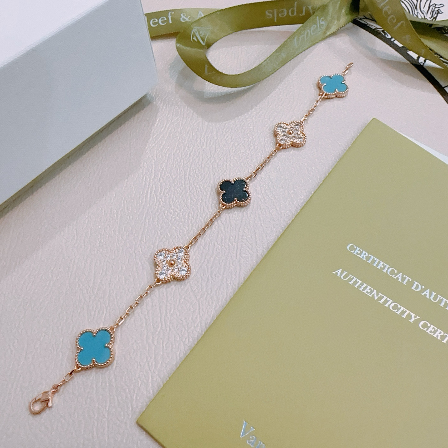 Van Cleef Arpels Alhambra bracelet Rose gold metal with turquoise blue black and clear diamond-accented four-leaf clover motifs 18cm
