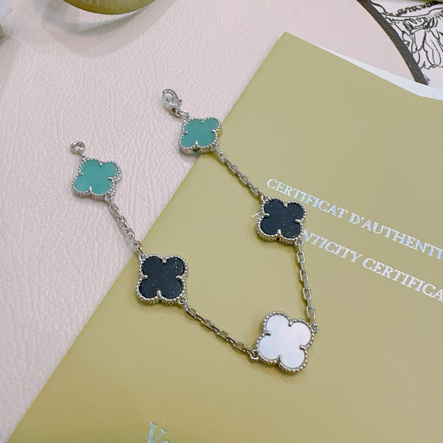Van Cleef Arpels Alhambra bracelet Silver-toned metal with turquoise black aventurine and white mother-of-pearl clover motifs 17cm