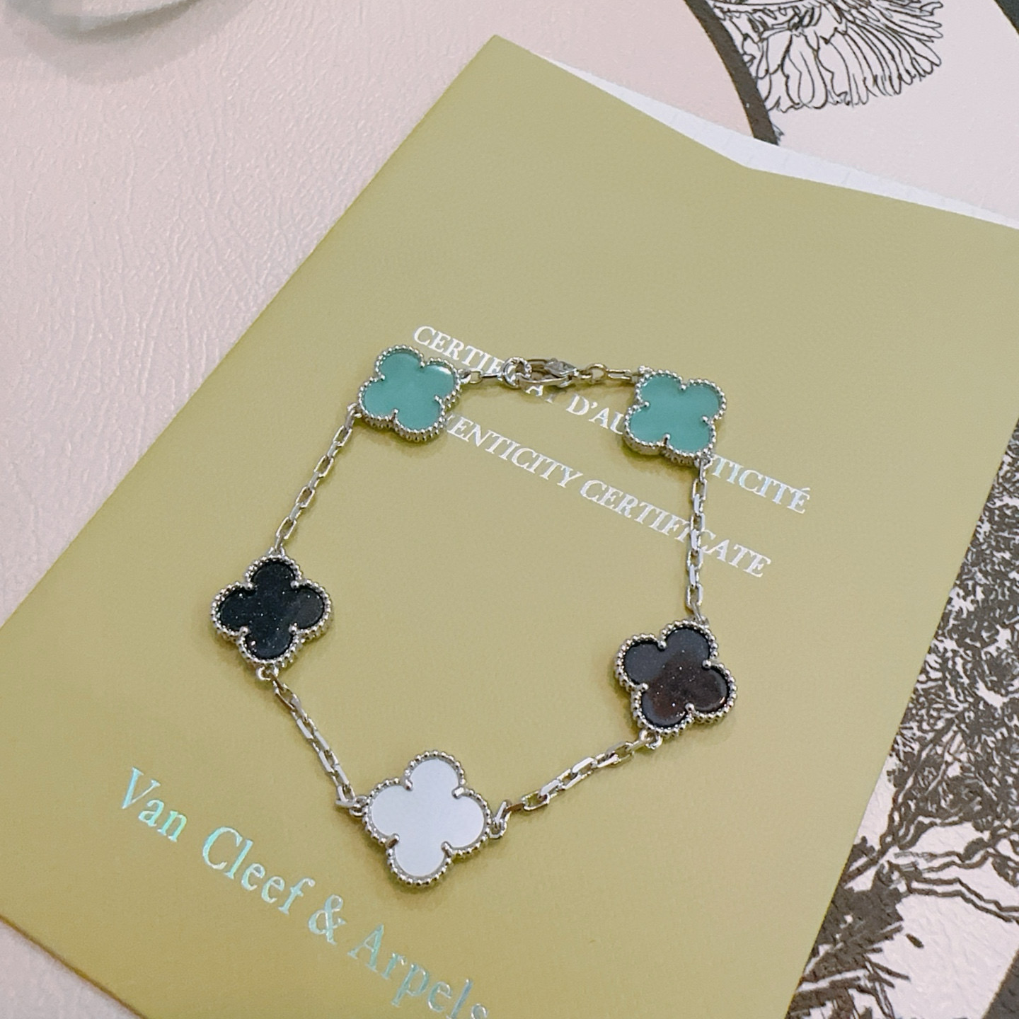 Van Cleef Arpels Alhambra bracelet Silver-toned metal with turquoise black aventurine and white mother-of-pearl clover motifs 17cm