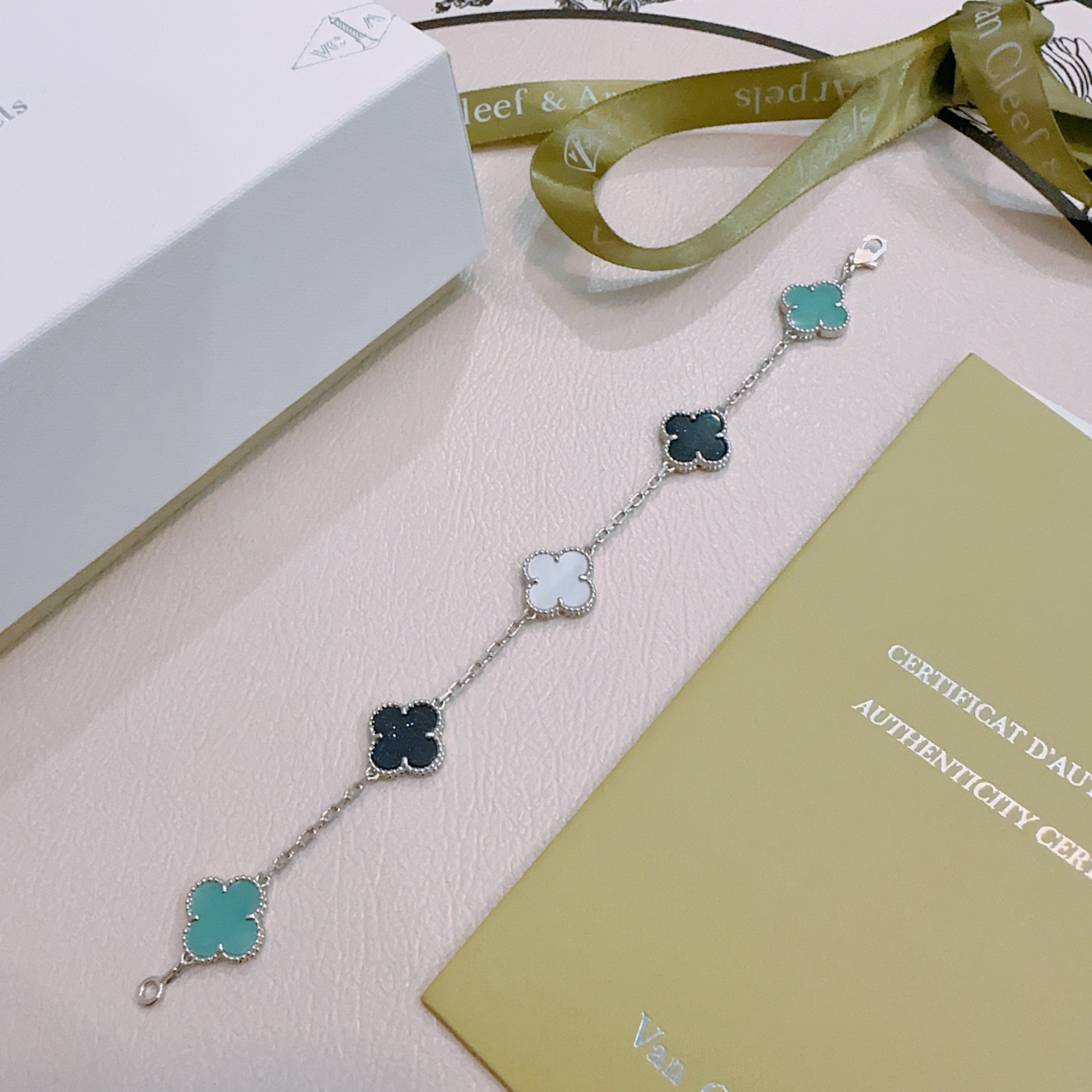 Van Cleef Arpels Alhambra bracelet Silver-toned metal with turquoise black aventurine and white mother-of-pearl clover motifs 17cm