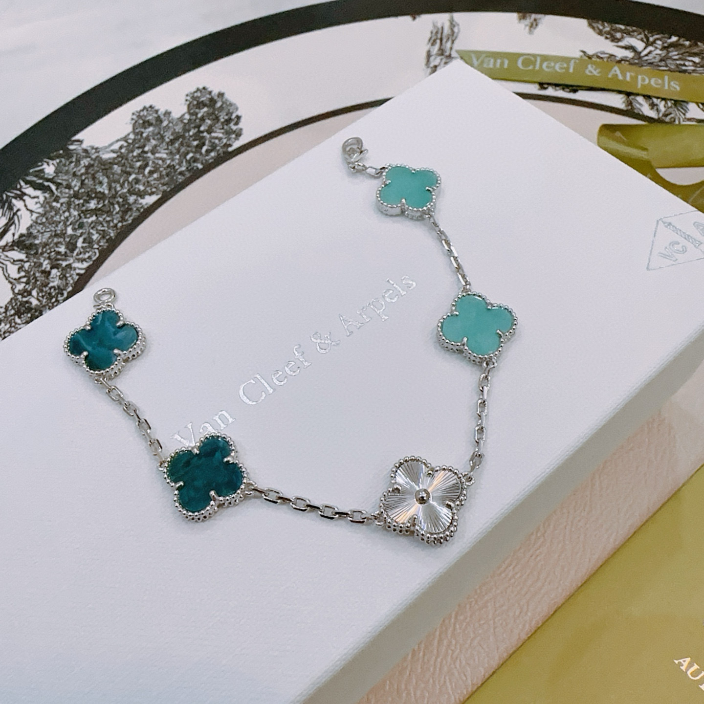 Van Cleef Arpels Alhambra bracelet Silver-toned metal with turquoise blue deep teal blue and white mother-of-pearl four-leaf clover motifs 18cm