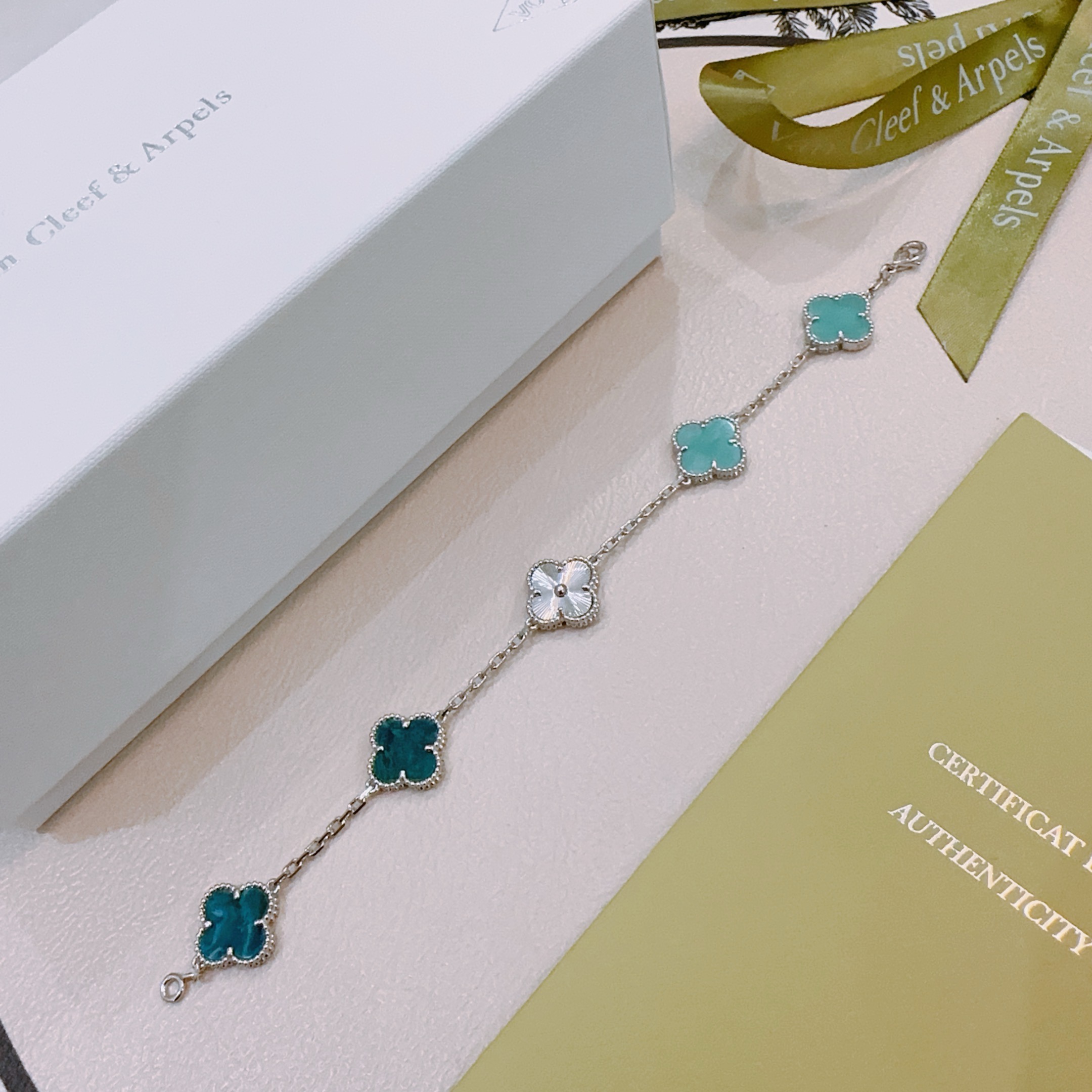 Van Cleef Arpels Alhambra bracelet Silver-toned metal with turquoise blue deep teal blue and white mother-of-pearl four-leaf clover motifs 18cm