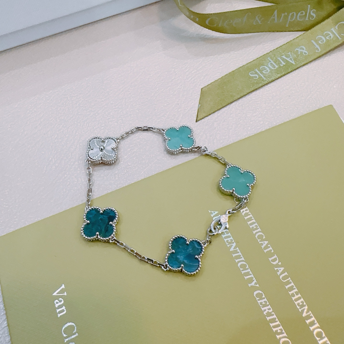 Van Cleef Arpels Alhambra bracelet Silver-toned metal with turquoise blue deep teal blue and white mother-of-pearl four-leaf clover motifs 18cm