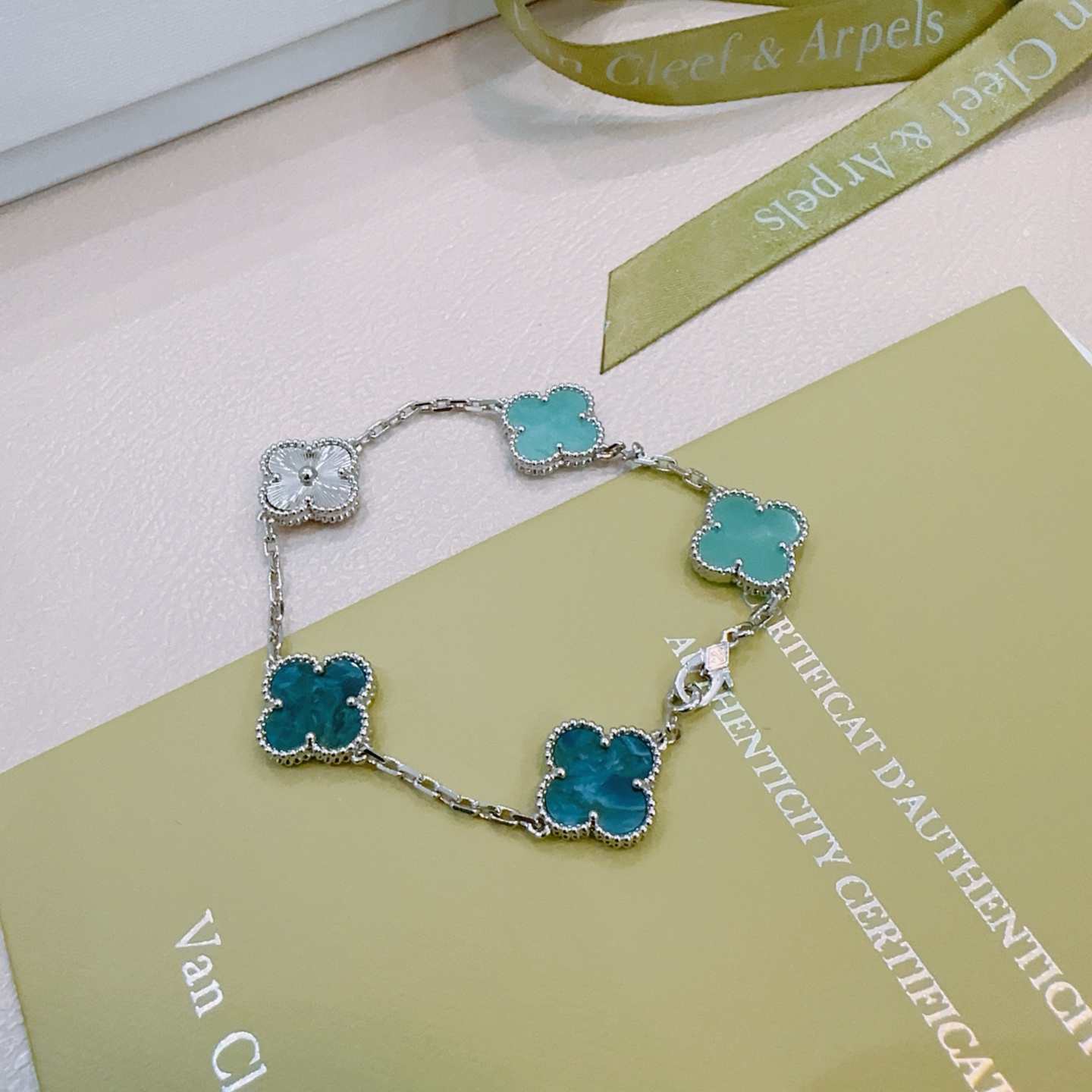 Van Cleef Arpels Alhambra bracelet Silver-toned metal with turquoise blue deep teal blue and white mother-of-pearl four-leaf clover motifs 18cm