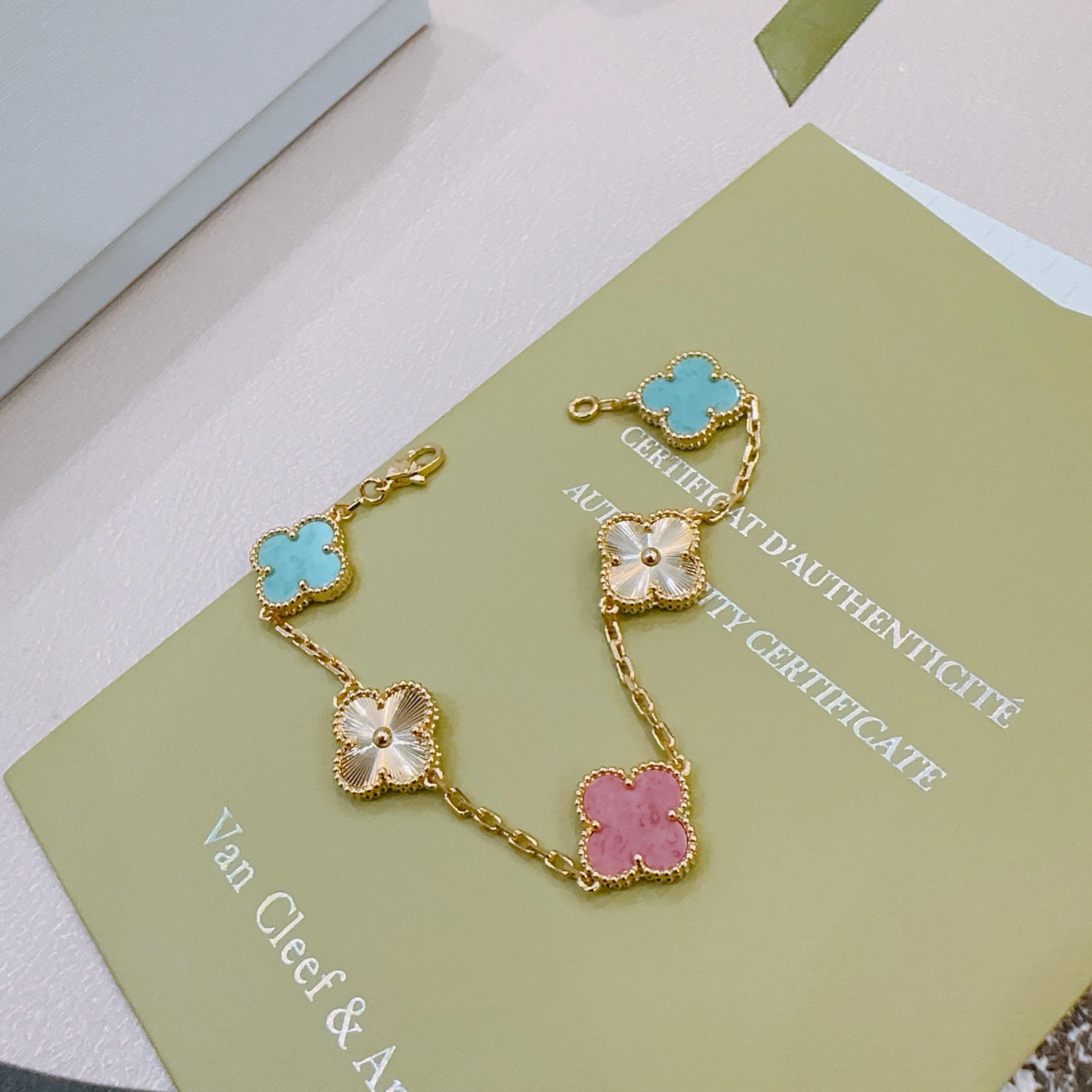 Van Cleef Arpels Alhambra bracelet Yellow gold metal with turquoise blue rhodonite pink and golden guilloche clover motifs 19cm