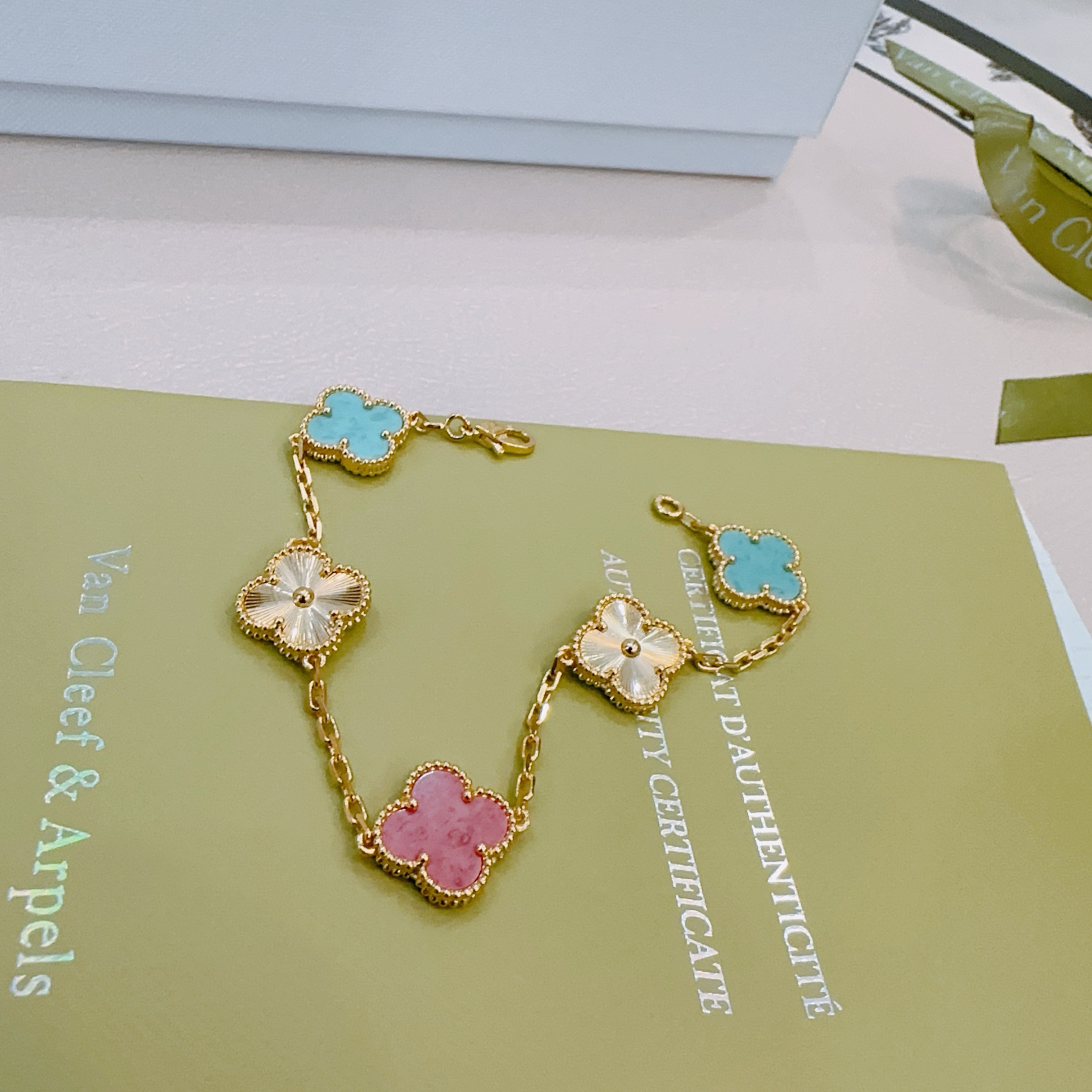 Van Cleef Arpels Alhambra bracelet Yellow gold metal with turquoise blue rhodonite pink and golden guilloche clover motifs 19cm