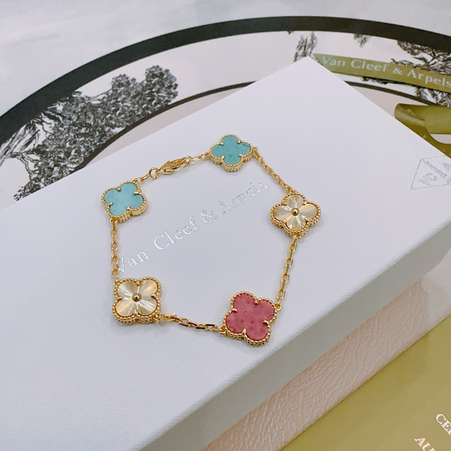 Van Cleef Arpels Alhambra bracelet Yellow gold metal with turquoise blue rhodonite pink and golden guilloche clover motifs 19cm