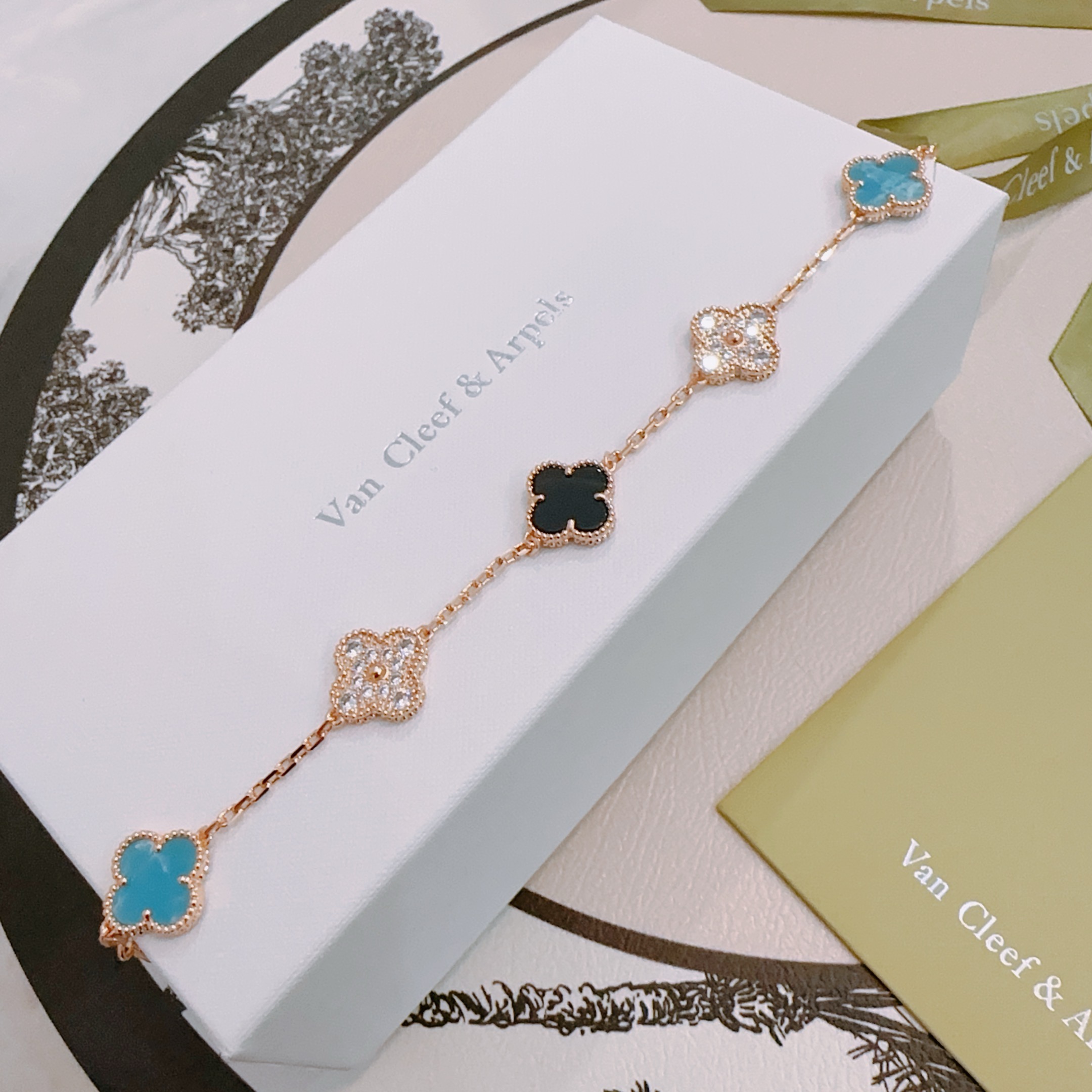 Van Cleef Arpels Alhambra bracelet Rose gold metal with turquoise blue black onyx and clear diamond-accented four-leaf clover motifs 17cm
