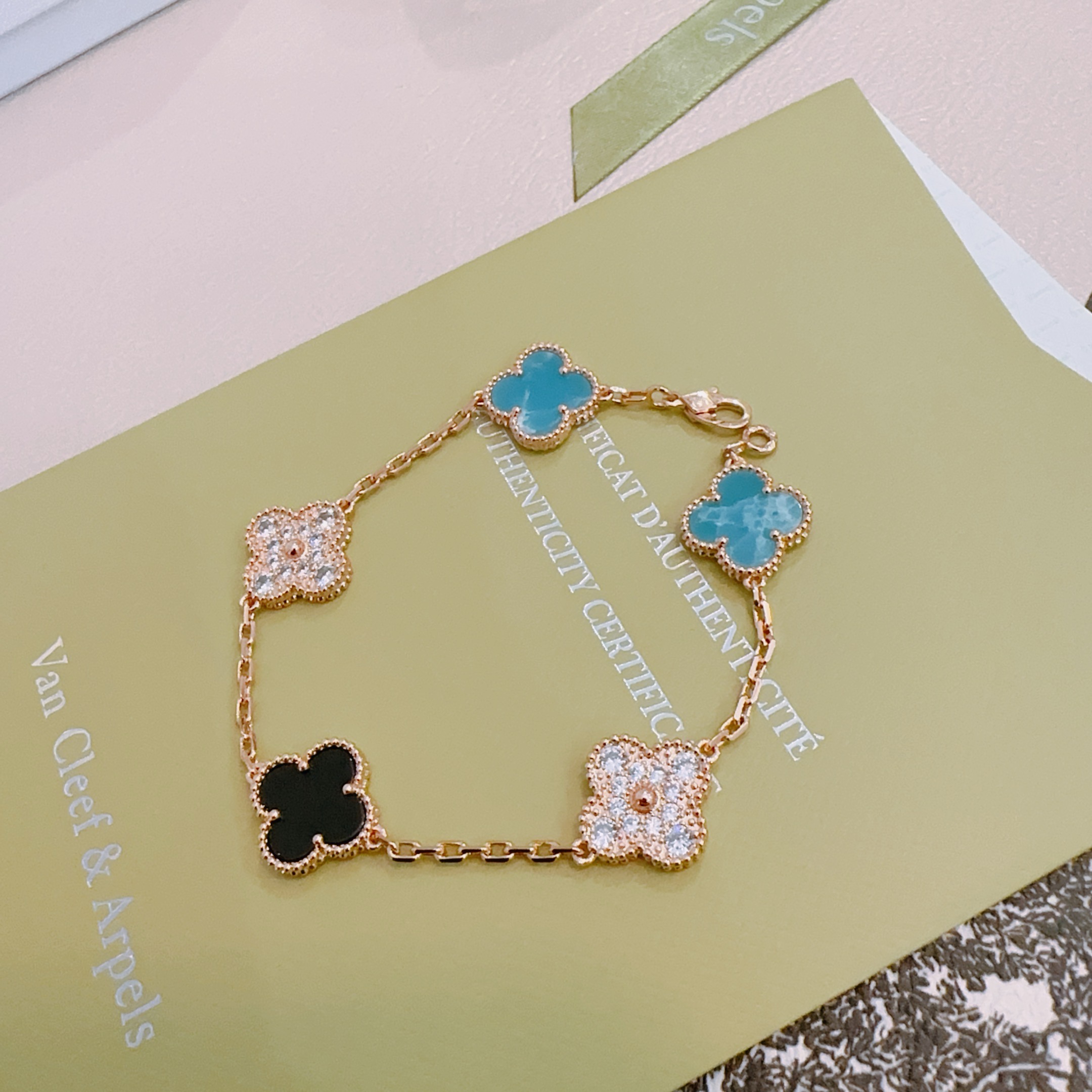 Van Cleef Arpels Alhambra bracelet Rose gold metal with turquoise blue black onyx and clear diamond-accented four-leaf clover motifs 17cm