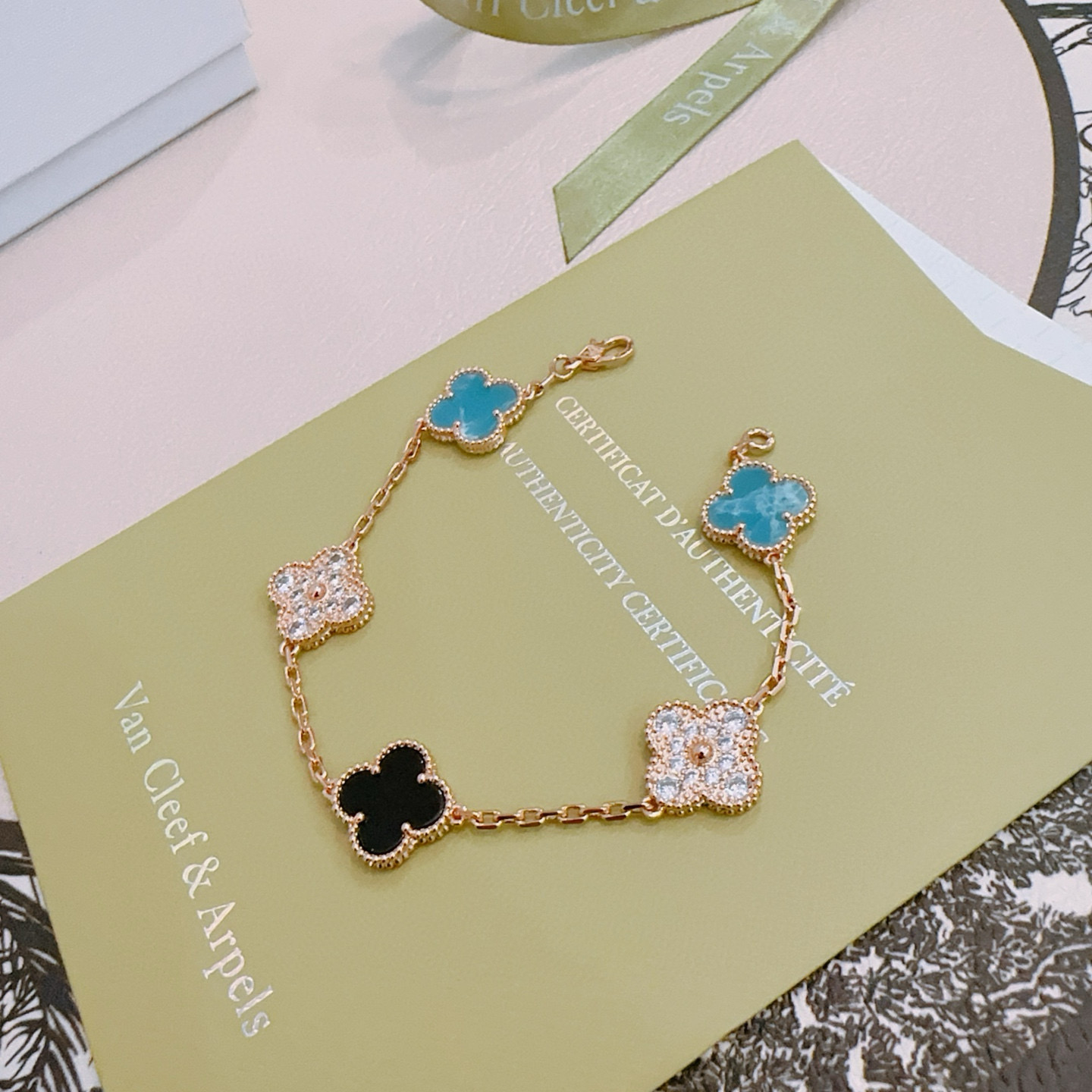 Van Cleef Arpels Alhambra bracelet Rose gold metal with turquoise blue black onyx and clear diamond-accented four-leaf clover motifs 17cm