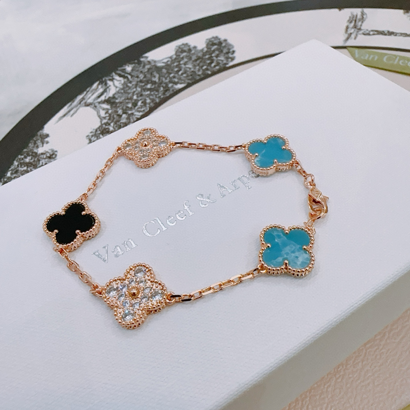 Van Cleef Arpels Alhambra bracelet Rose gold metal with turquoise blue black onyx and clear diamond-accented four-leaf clover motifs 17cm