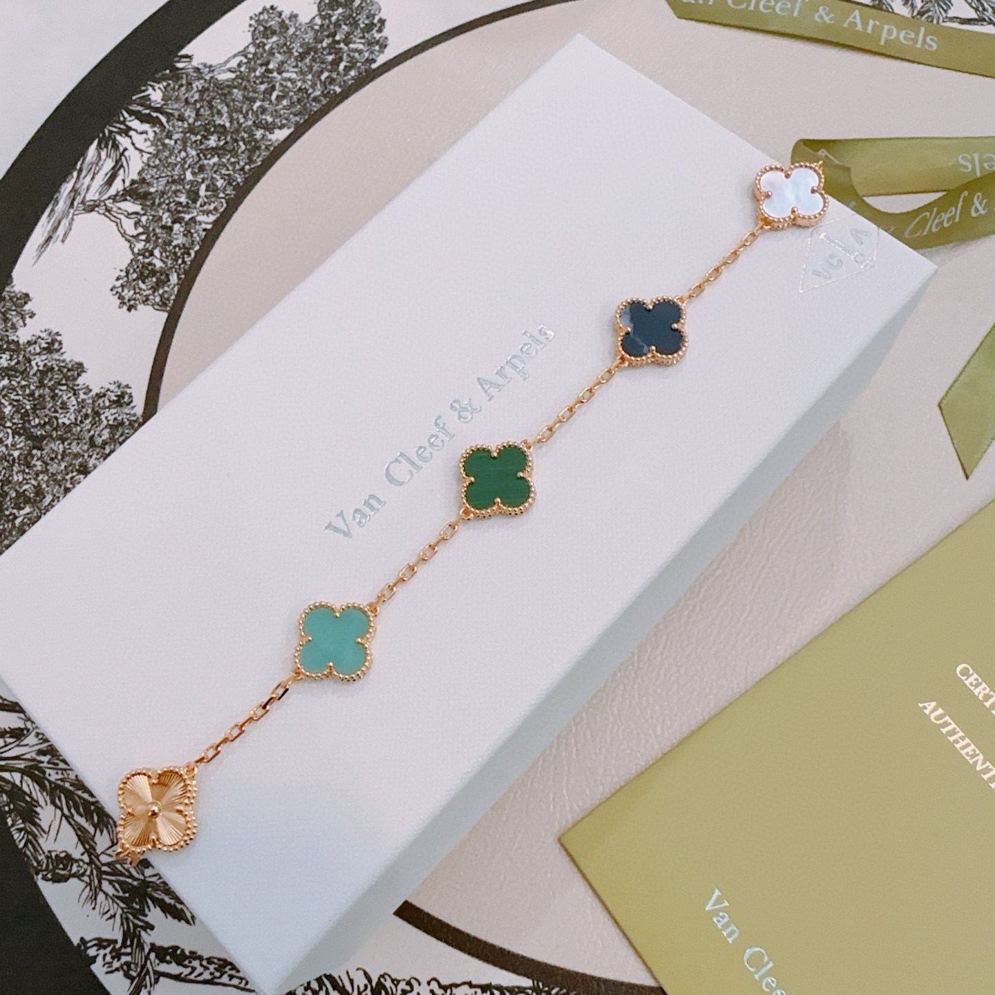 Van Cleef Arpels Alhambra bracelet Rose gold metal with green malachite dark blue stone turquoise white mother-of-pearl and guilloche rose gold clover motifs 19cm
