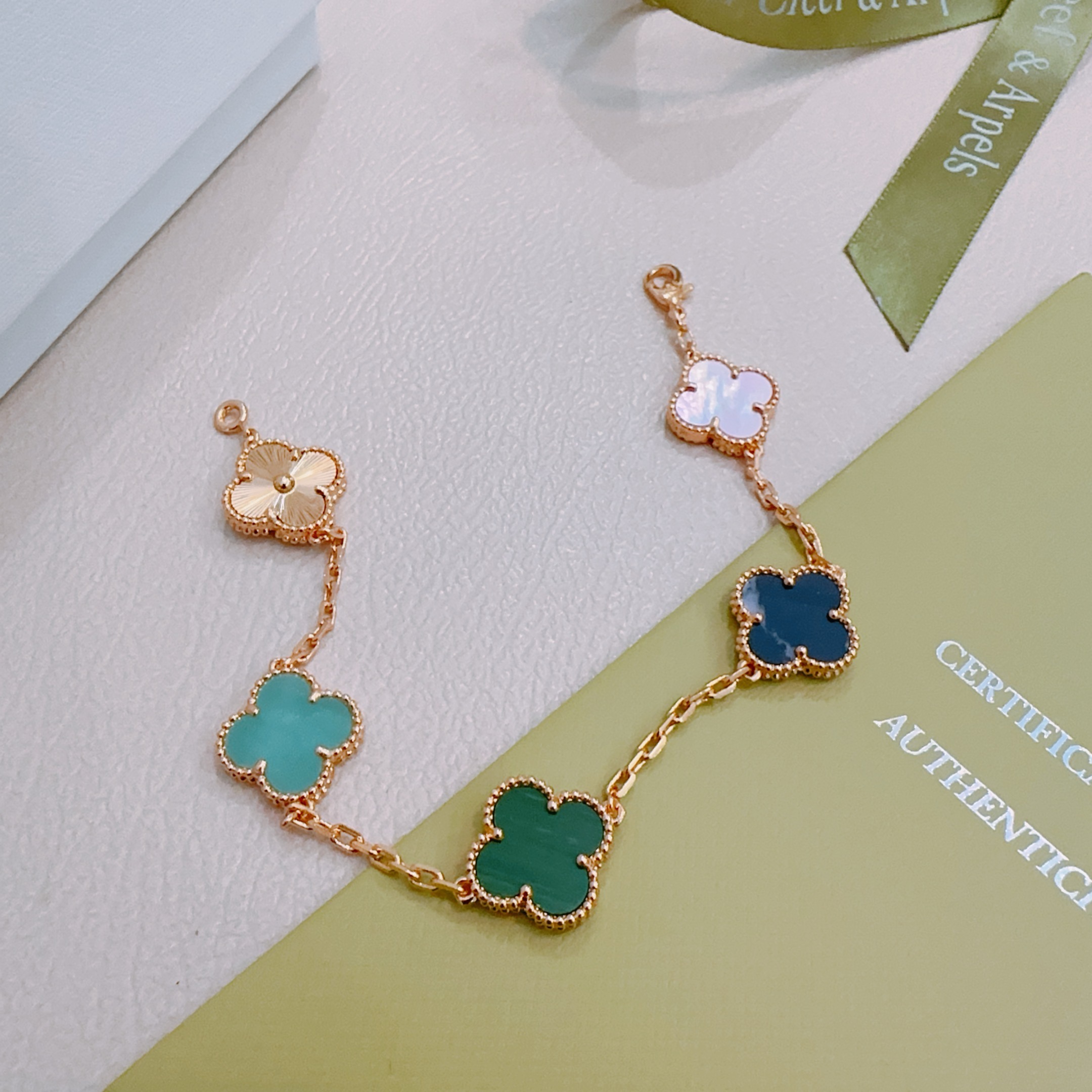 Van Cleef Arpels Alhambra bracelet Rose gold metal with green malachite dark blue stone turquoise white mother-of-pearl and guilloche rose gold clover motifs 19cm