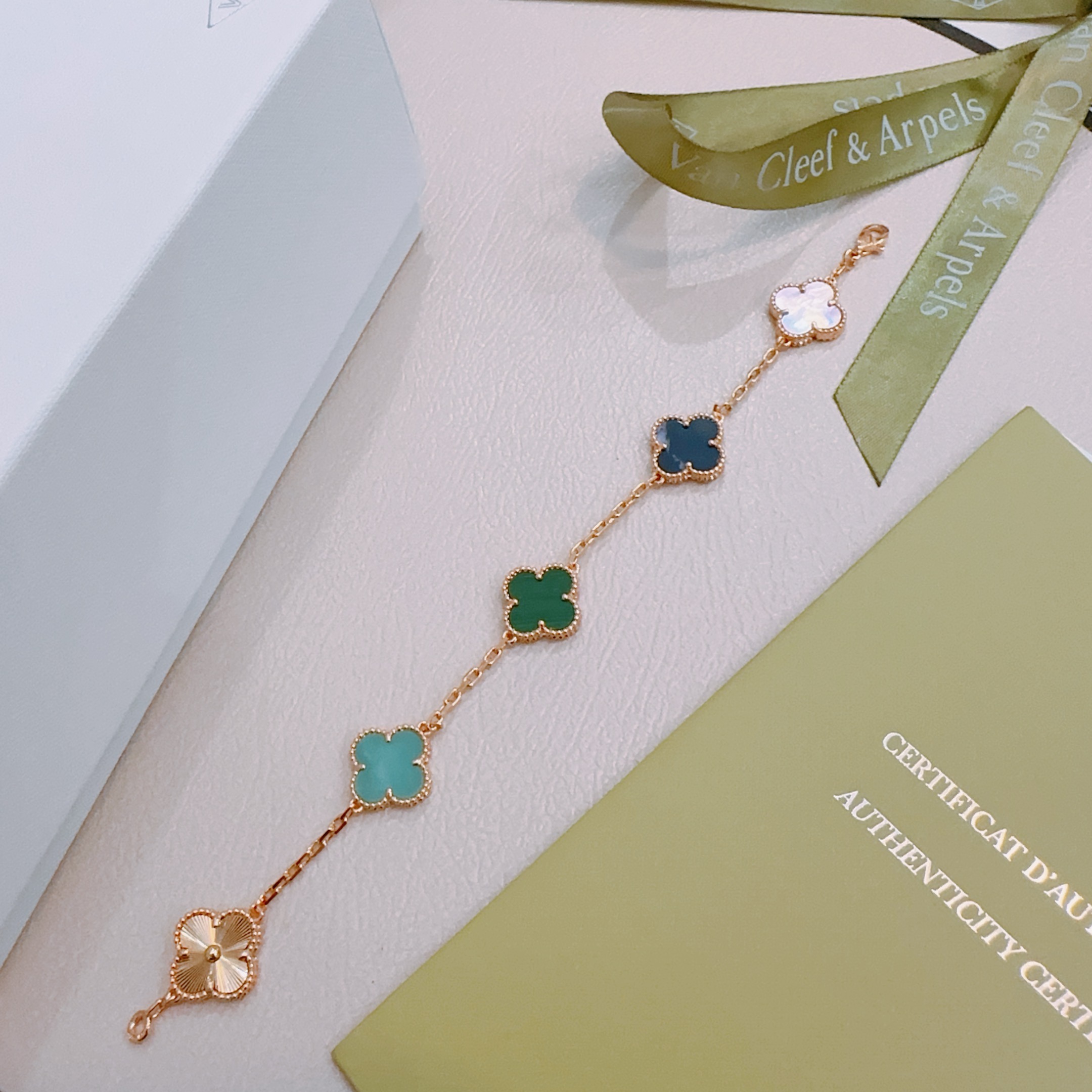 Van Cleef Arpels Alhambra bracelet Rose gold metal with green malachite dark blue stone turquoise white mother-of-pearl and guilloche rose gold clover motifs 19cm