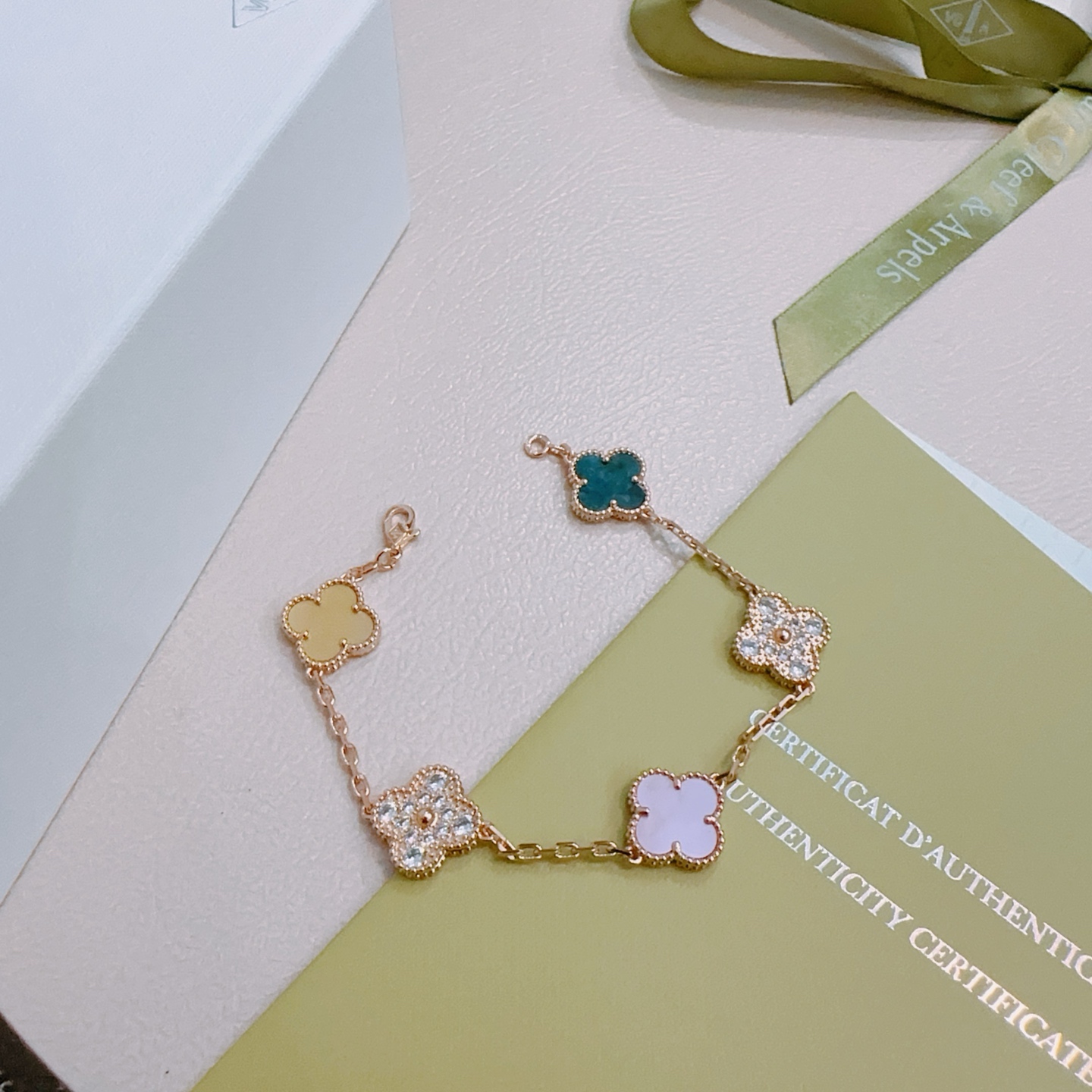 Van Cleef Arpels Alhambra bracelet Rose gold metal with white mother-of-pearl teal agate champagne mother-of-pearl opal and clear diamond accents 17cm